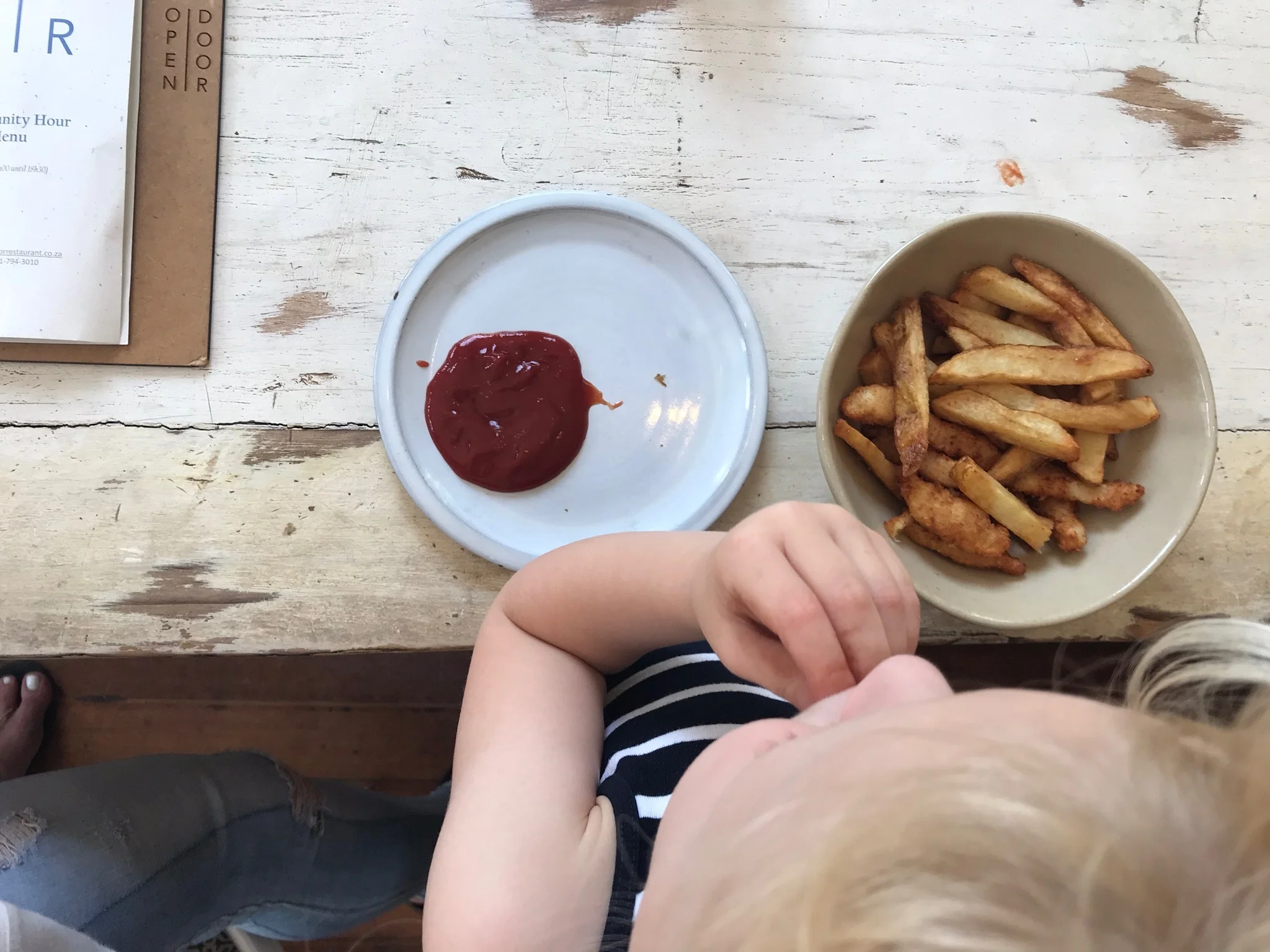 Is she eating chips with tomato sauce or T.S with chips?? 