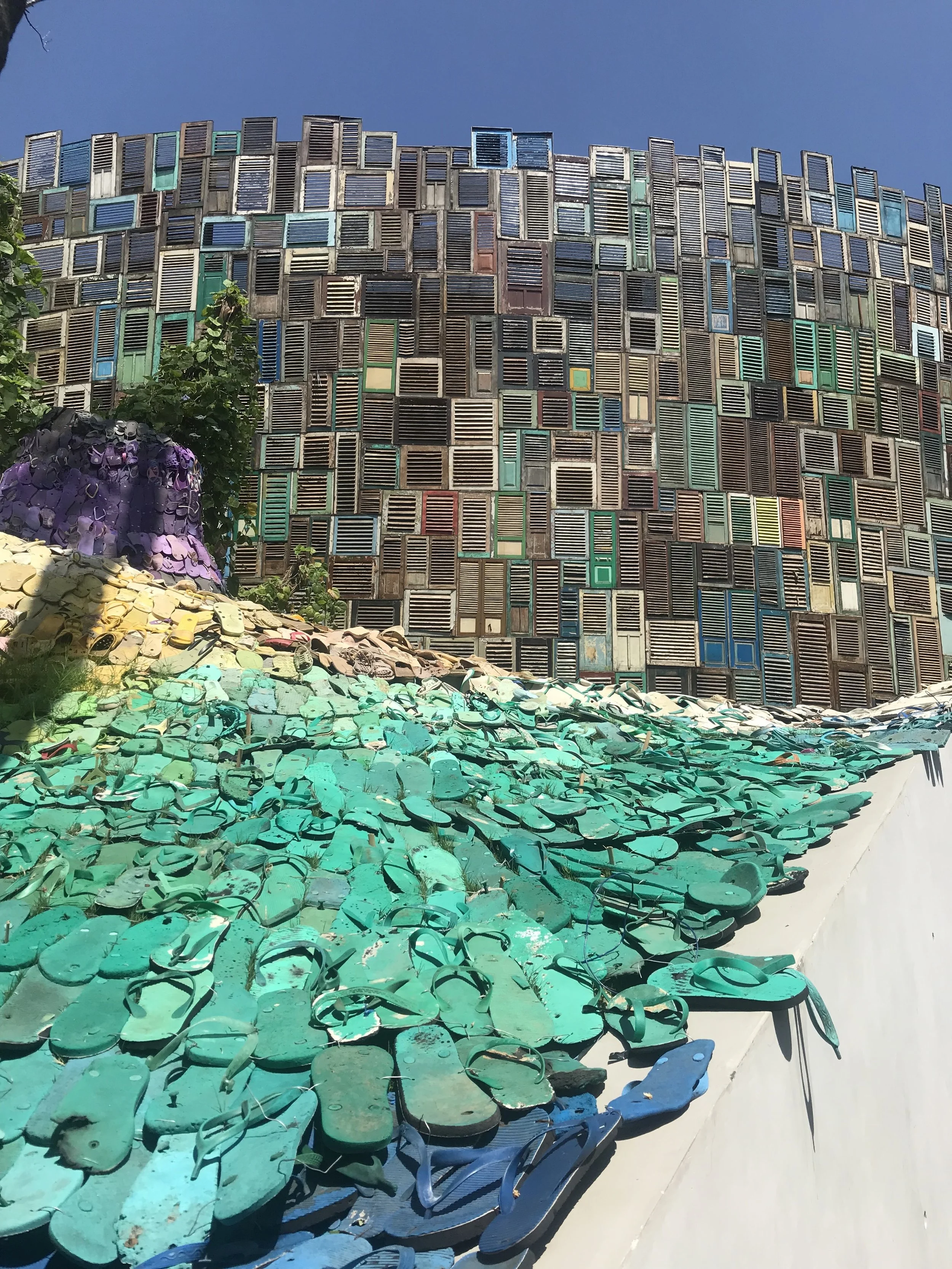 Flip flops that were found on the beach and recycled to create this incredibly cool entrance to Potato Head Beach Club