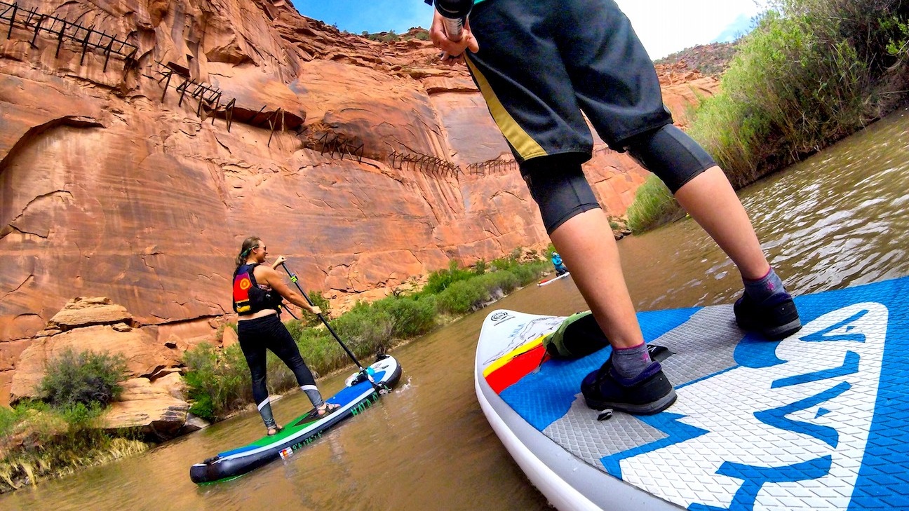 Stand up paddle boarding the under the Hanging Flume on the Lower Dolores River