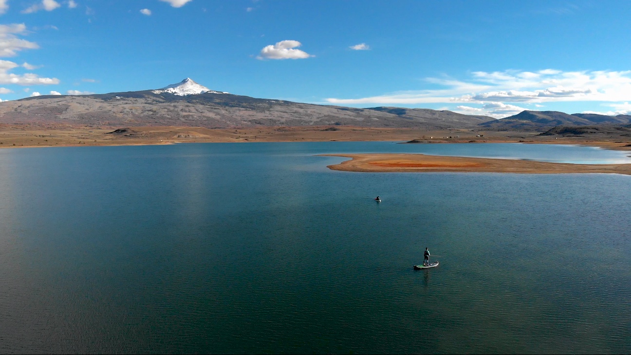 Stand up paddle boarding fly fishing on Miramonte Reservoir near Norwood Colorado