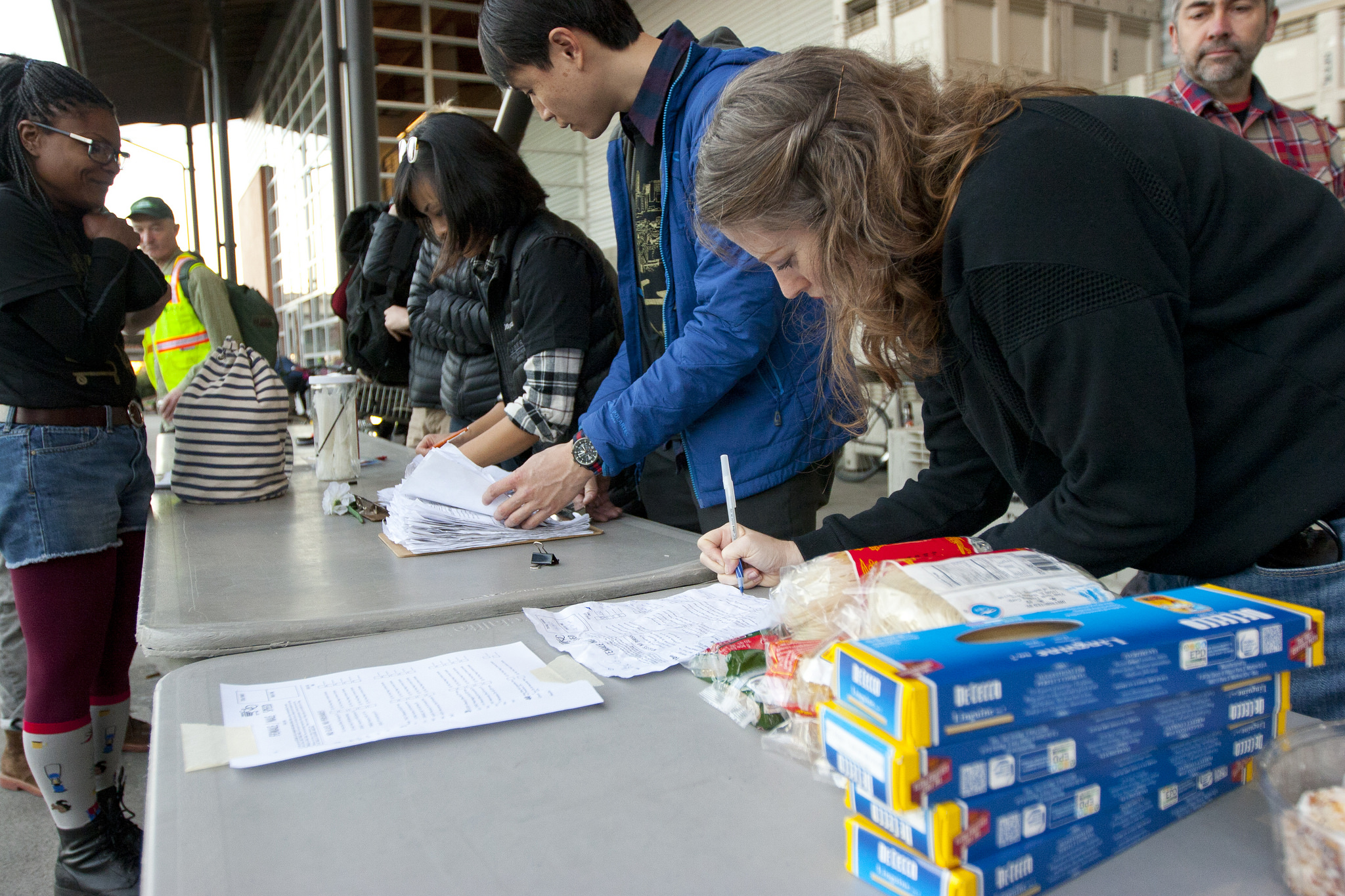Final speed category manifests being tallied and sorted. Photo by Jonathan Koshi