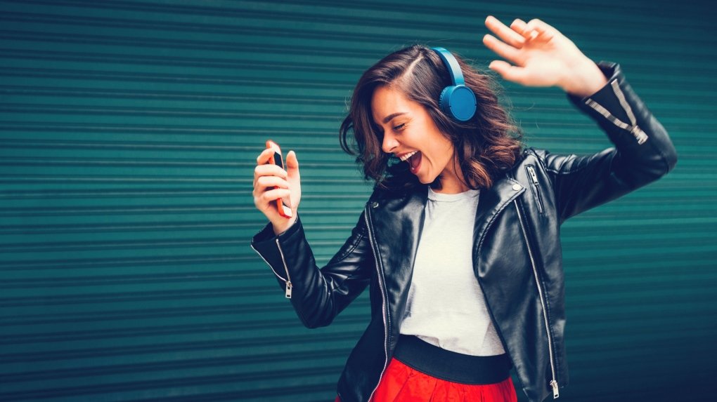 Woman in leather jacket listening to music.jpg