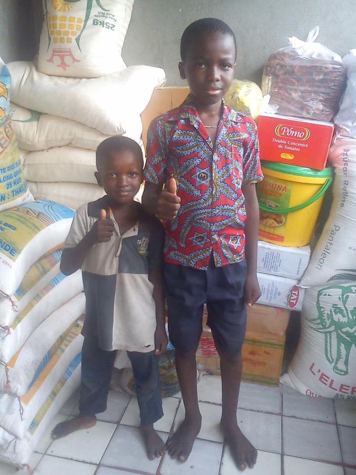 This is Samuel and Platini giving us a "thumbs up" during one of our food deliveries.