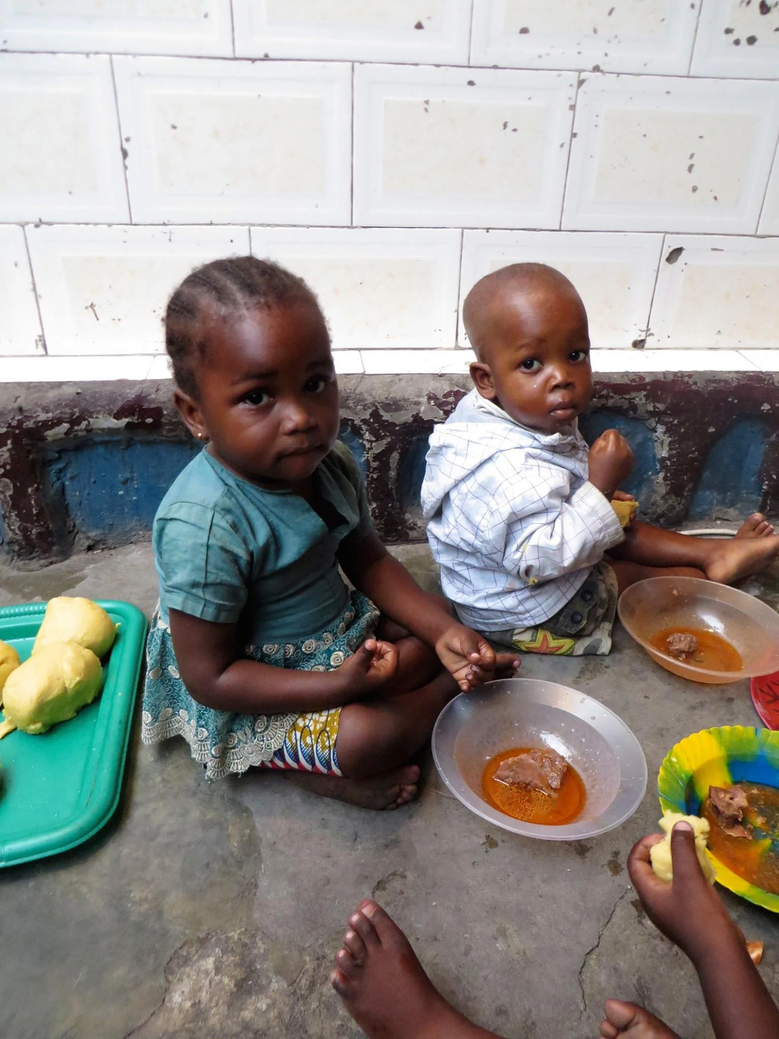 Children eating at the Amiband orphanage.