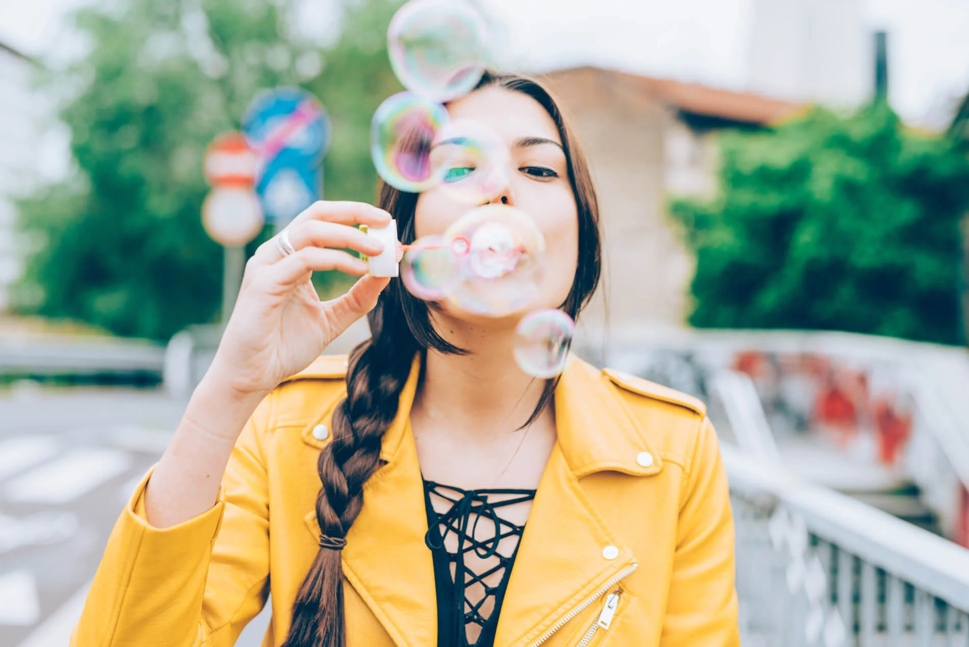 hipster-woman-playing-with-bubble-soap-PSK656C.jpg