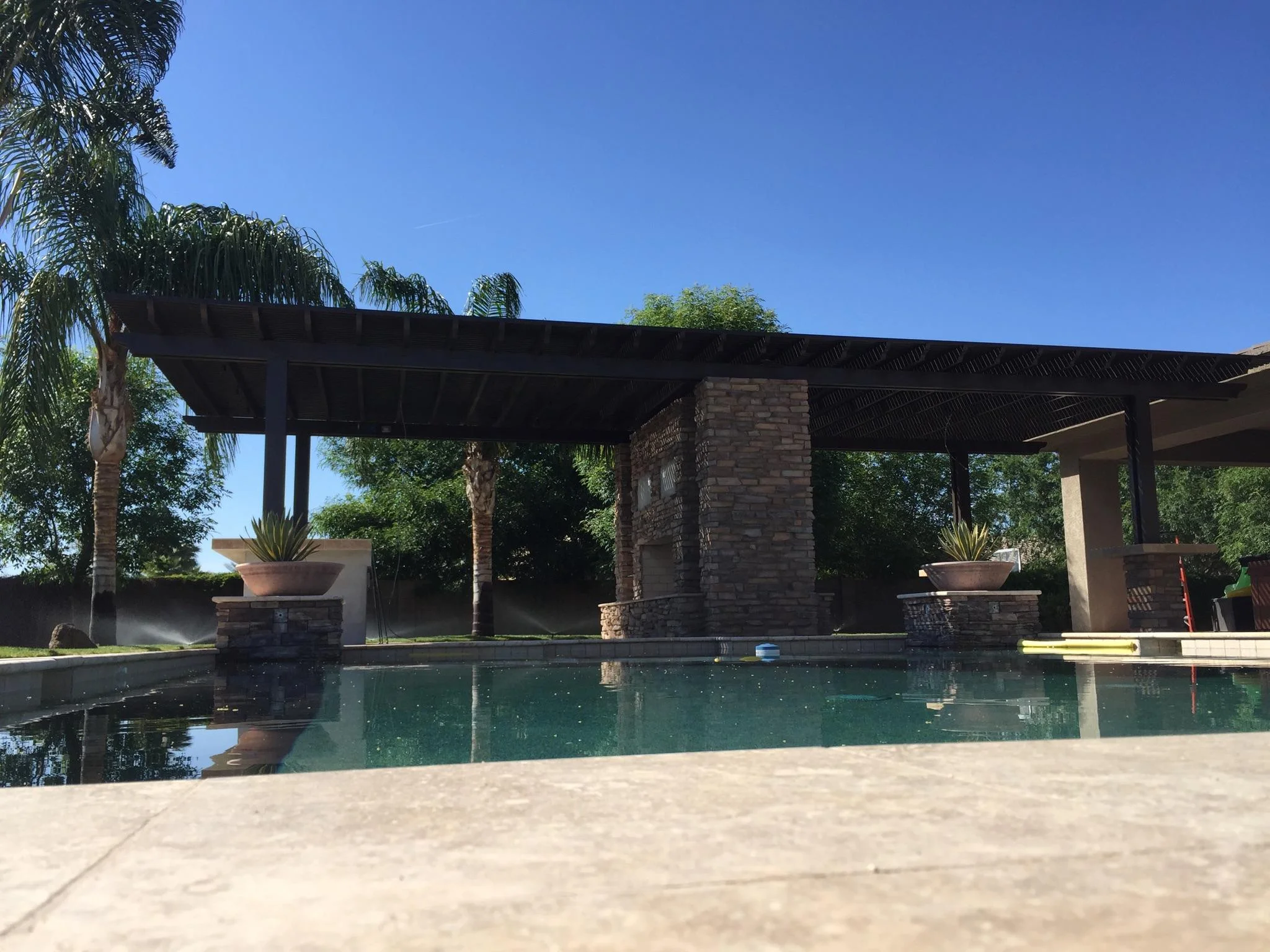 Alumawood pergola with double sided fireplace.jpg