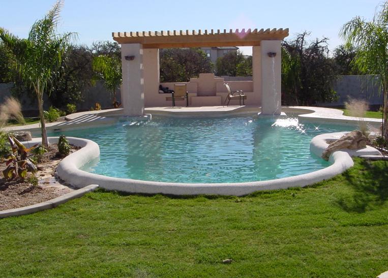 Raised stucco column and wood pergola with built in water feature.JPG
