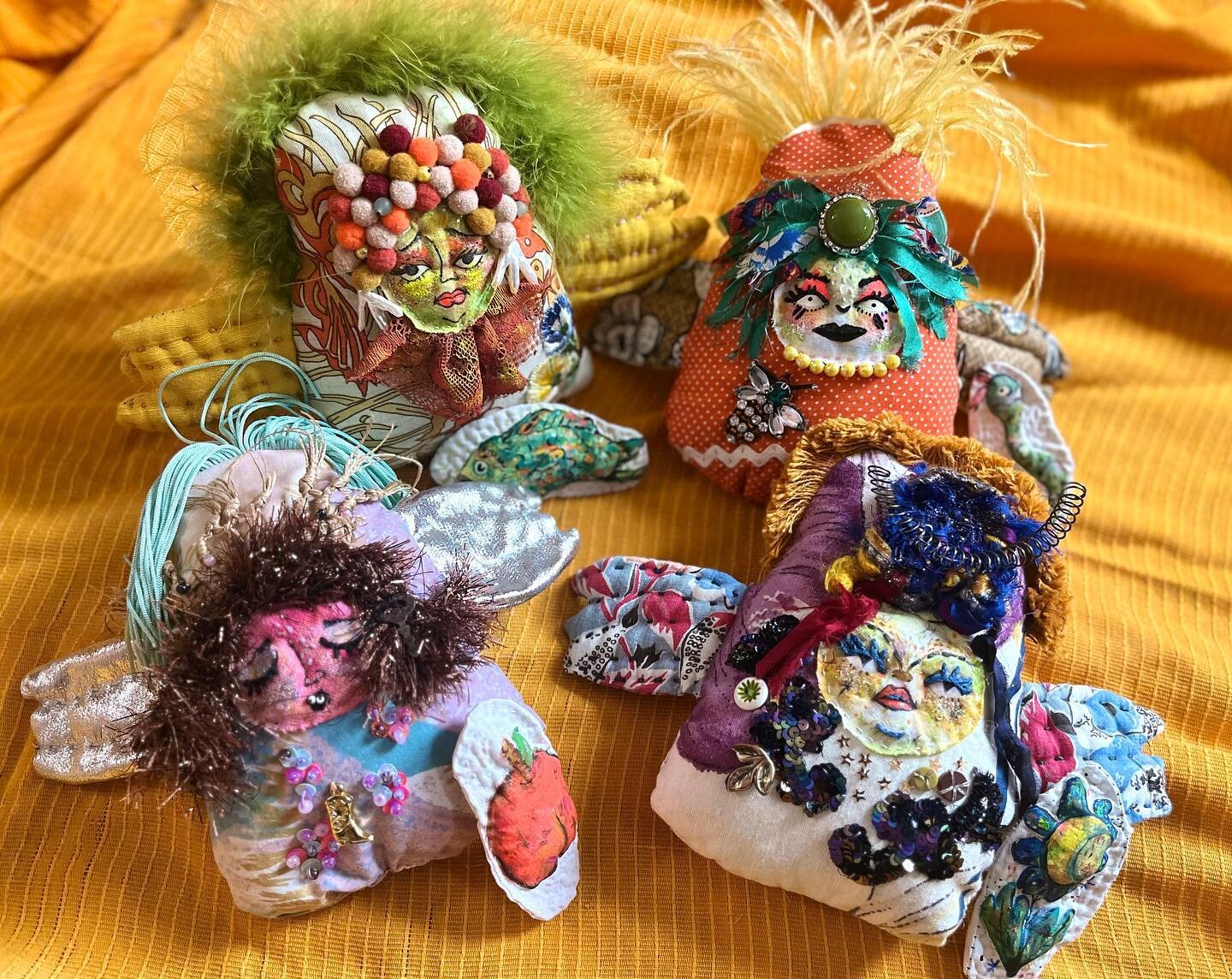 I think the world would be a better place if everybody carried symbolism in their back pocket. 

The dolls that carry a fish, a snake, a peach, &amp; a moon flower. 

#folkdolls #handmadedolls #dollscollector