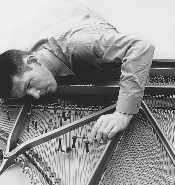 Cage preparing a piano, 1947. Image from intelligentarts.net