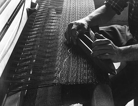 Student Bill Reed’s hands at the loom, Black Mountain College, ca. 1938–42. Photograph by Claude Stoller