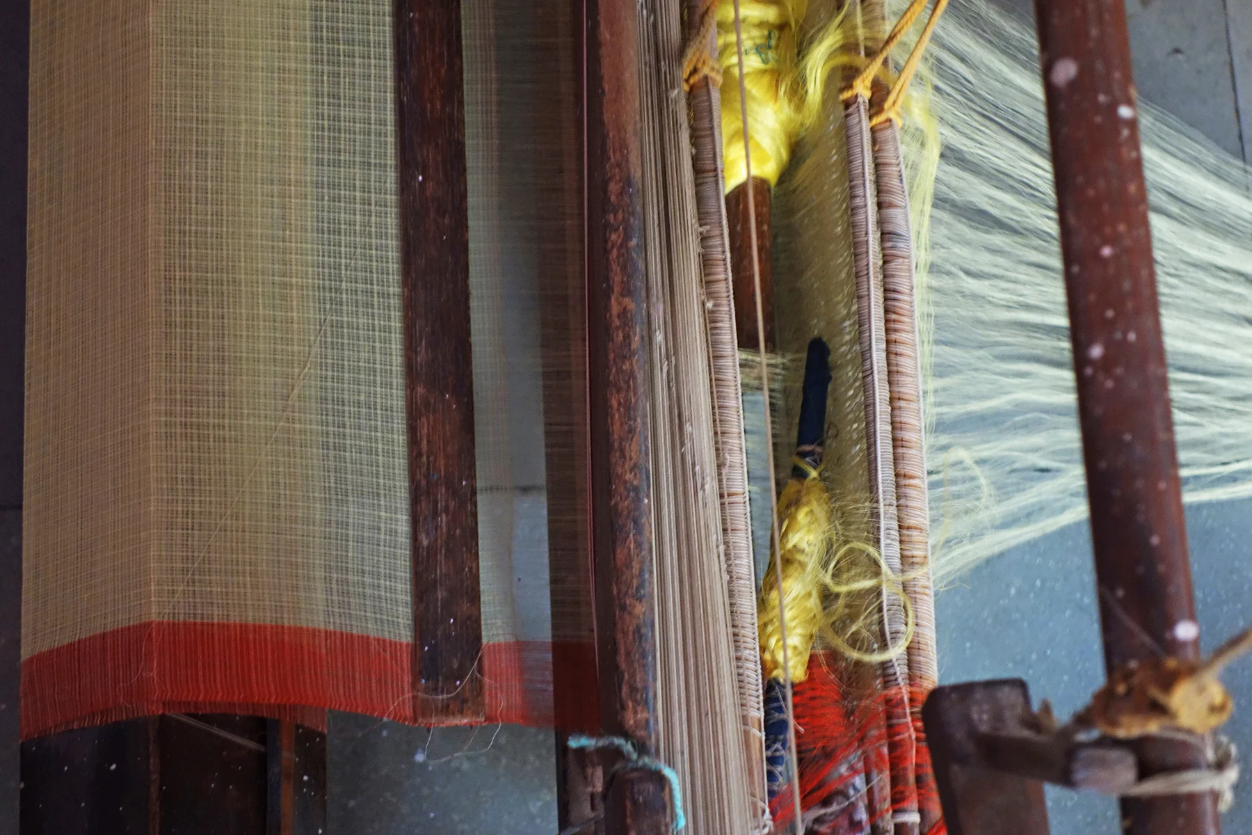 A detail of plain khat fabric being woven by Badrun Nisha
