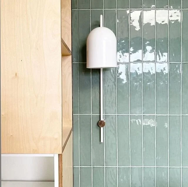 Beautiful sea foam tiles complement Nightworks Studio's Duomo Stem wall light, at the William St House by Amy Stead.⁠ Shipped directly to your door.