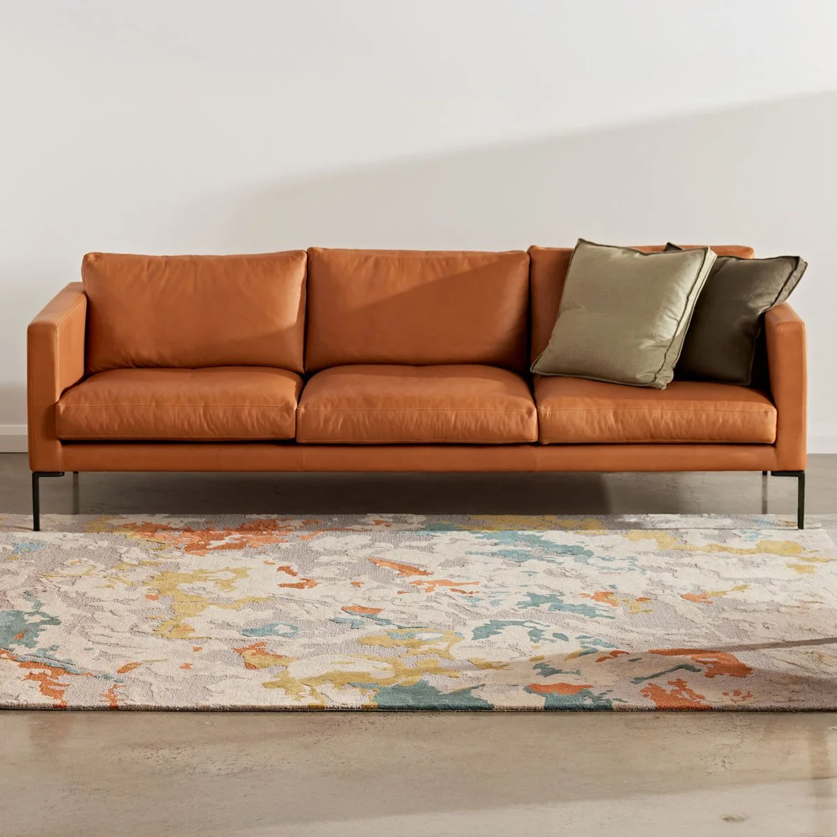 With soft lines and plush comfort, the Spencer Sofa offers a relaxed, welcoming feel. Available in fabric or leather, it’s ideal for comfort-focused living rooms.