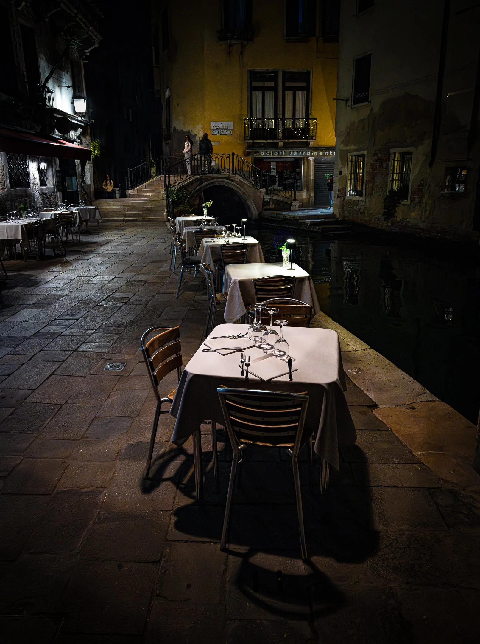 Graeme McGibbon - Waiting for guests, Venice - This shot of the back streets of Venice was taken late evening: f8, 1/30sec, iso10000, -1.7step at 24mm hand held. The lighting in the area was very subdued  and atmospheric and it was this mood I wanted
