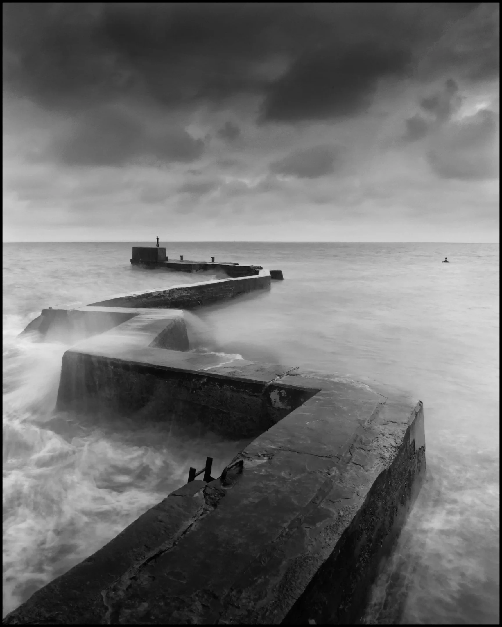 Len Downes - The Zig Zag Breakwater - Built by Robert Stevenson to protect the harbour of St Monans. Success relies on timing so that the tide is right, the wind is blowing the spray and the tripod is sturdy. Canon R6 Mkii 0.5sec, f22, 8000 ISO.