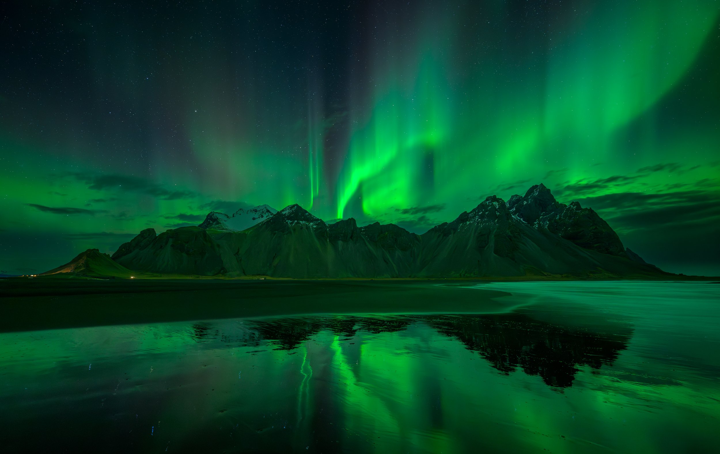 Mike Morley - Aurora at Vestrahorn in Iceland - After a long wait out in the cold,  I stood in the shallows of the sea with boots full of icy water just to get this reflection. Taken with Nikon 14-24mm lens at f/2.8 with 6 seconds and ISO 3200