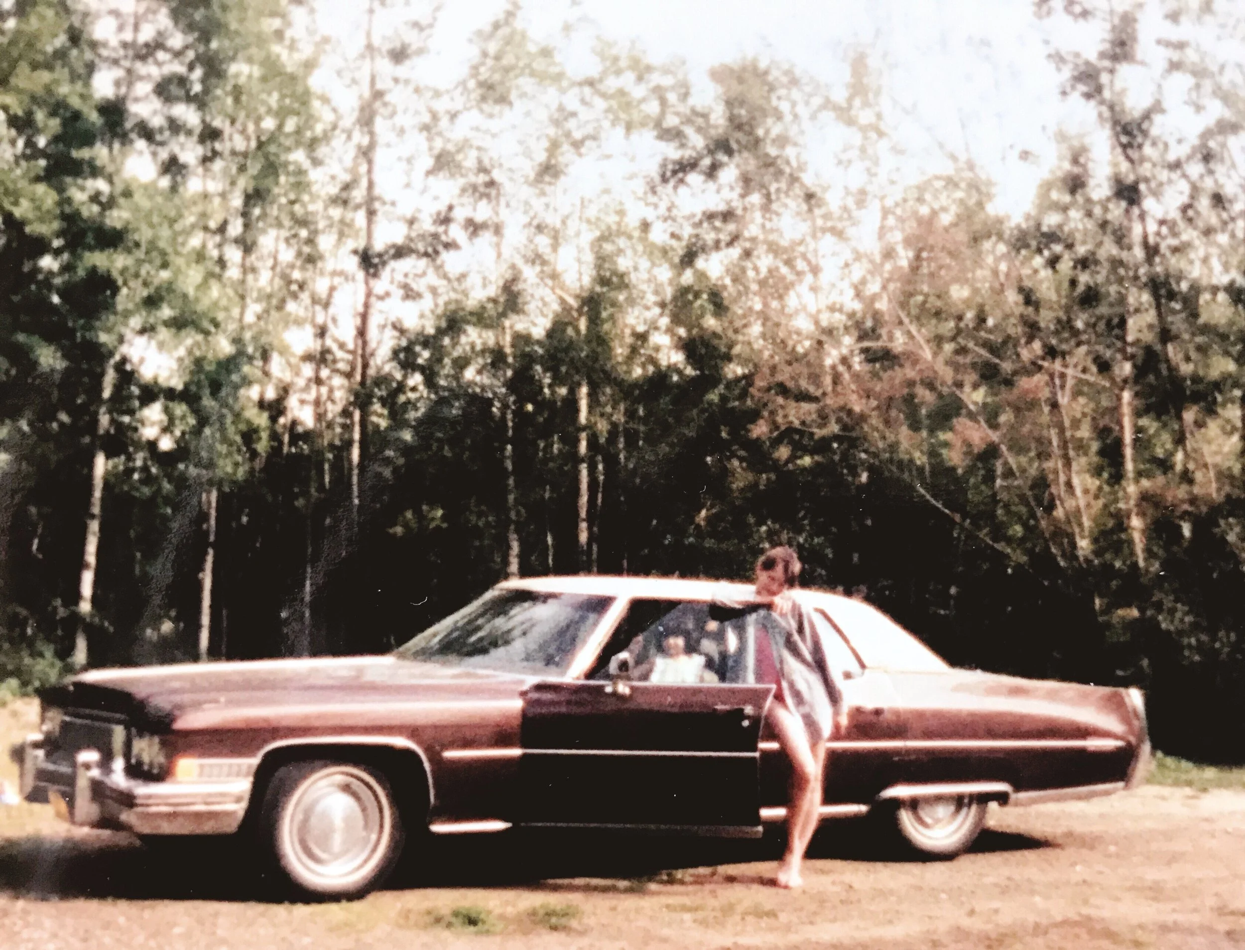 Me with our hoopty and my baby sister in Alaska