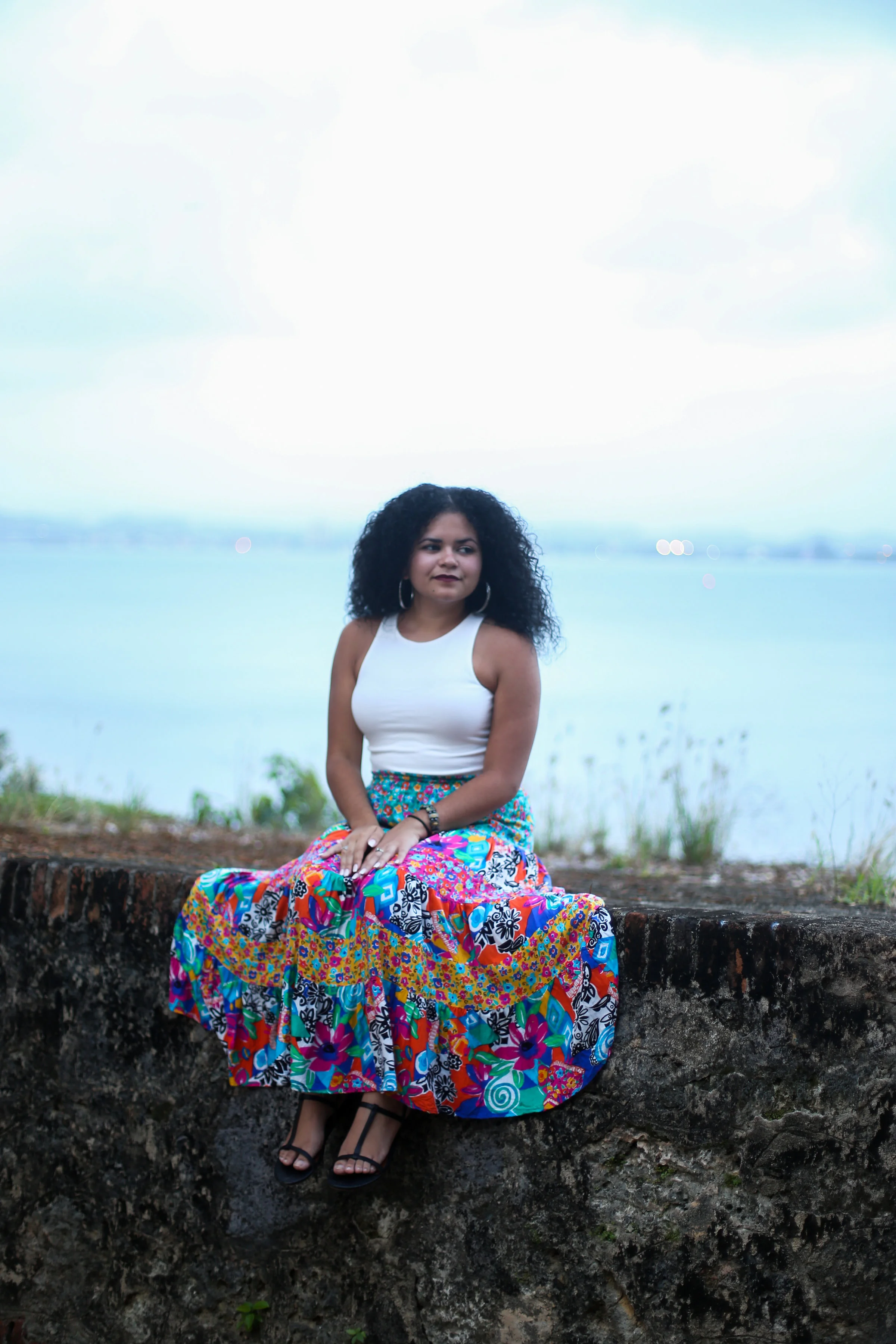 Tatiana Figueroa-Ramirez was born on the sofrito-infused island of Puerto Rico to a military family and as an Afroboricua names Julia de Burgos as her greatest inspiration. Tatiana graduated with a B.A. in English Literature and a minor in American Studies from the University of Maryland, Baltimore County (UMBC). She is a VONA/Voices Alumna having studied under award-winning poet Willie Perdomo. Tatiana has been published in Pool Poetry , Spillwords , The Acentos Review , A Gypsy's Library , and Here Comes Everyone: East & West Issue . She mainly performs in the greater Washington D.C. area, but has also shared her work throughout the continental United States and the Dominican Republic. She is currently working on her first collection of poetry Coconut Curls y Café con Leche . Follow her on Instagram @msauciana Read more about her and her work on her website www.sincerelytatiana.com