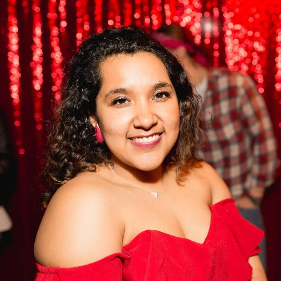 Linzy Beltran, first generation daughter of immigrant parents who escaped the Salvadoran Civil War of the 1980s. She is co-founder of the comedy collective Glam Fam .