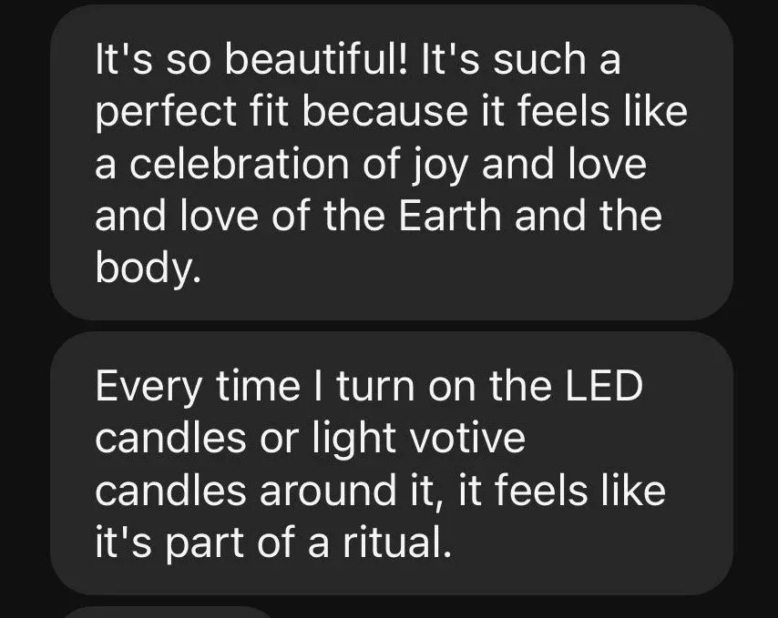 Screenshot of a person expressing joy and love while describing the use of LED candles and light votive candles in a ritual.