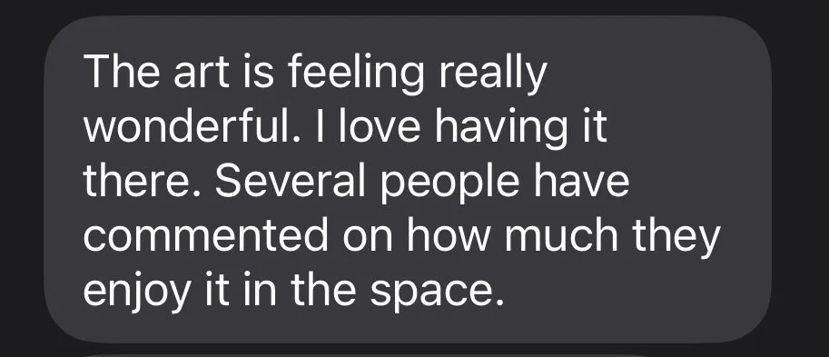 A screenshot of a message or review praising the art, expressing love for it and noting positive comments from others about its enjoyment in the space.