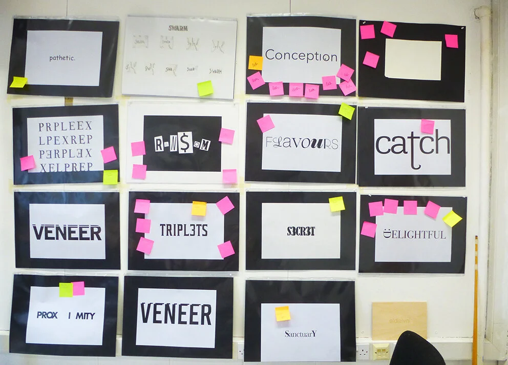 A section of the studio critique wall