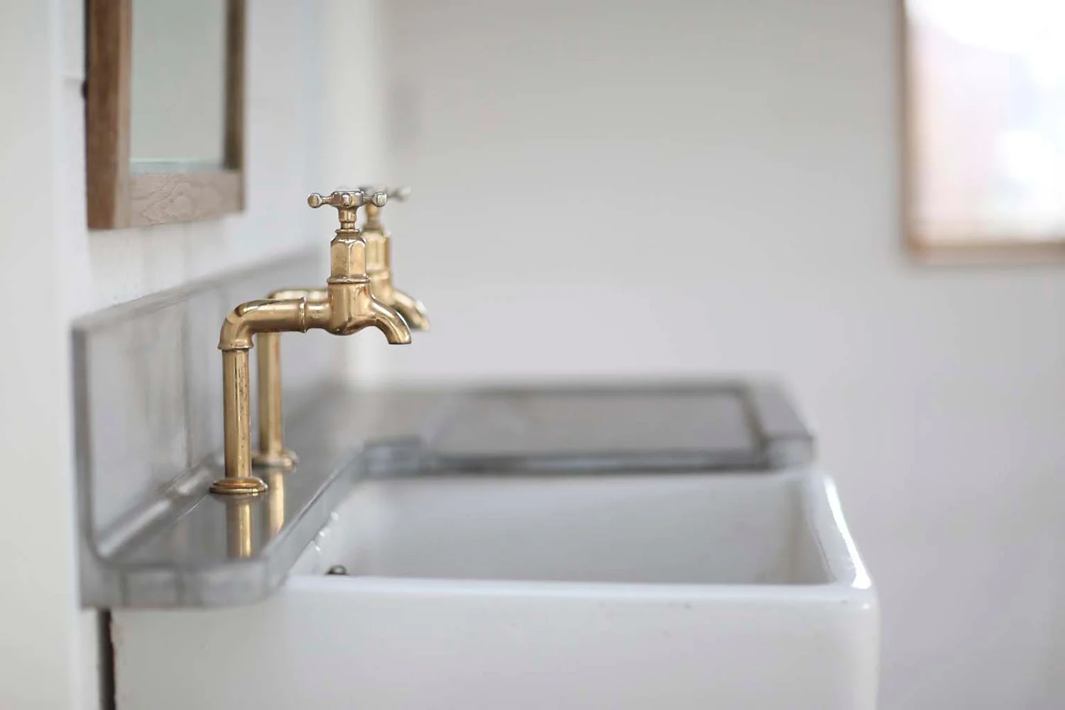 Cast and polished concrete surrounding a Belfast sink, only 30mm thickness and high upstaged/splashback, Tinney and Co