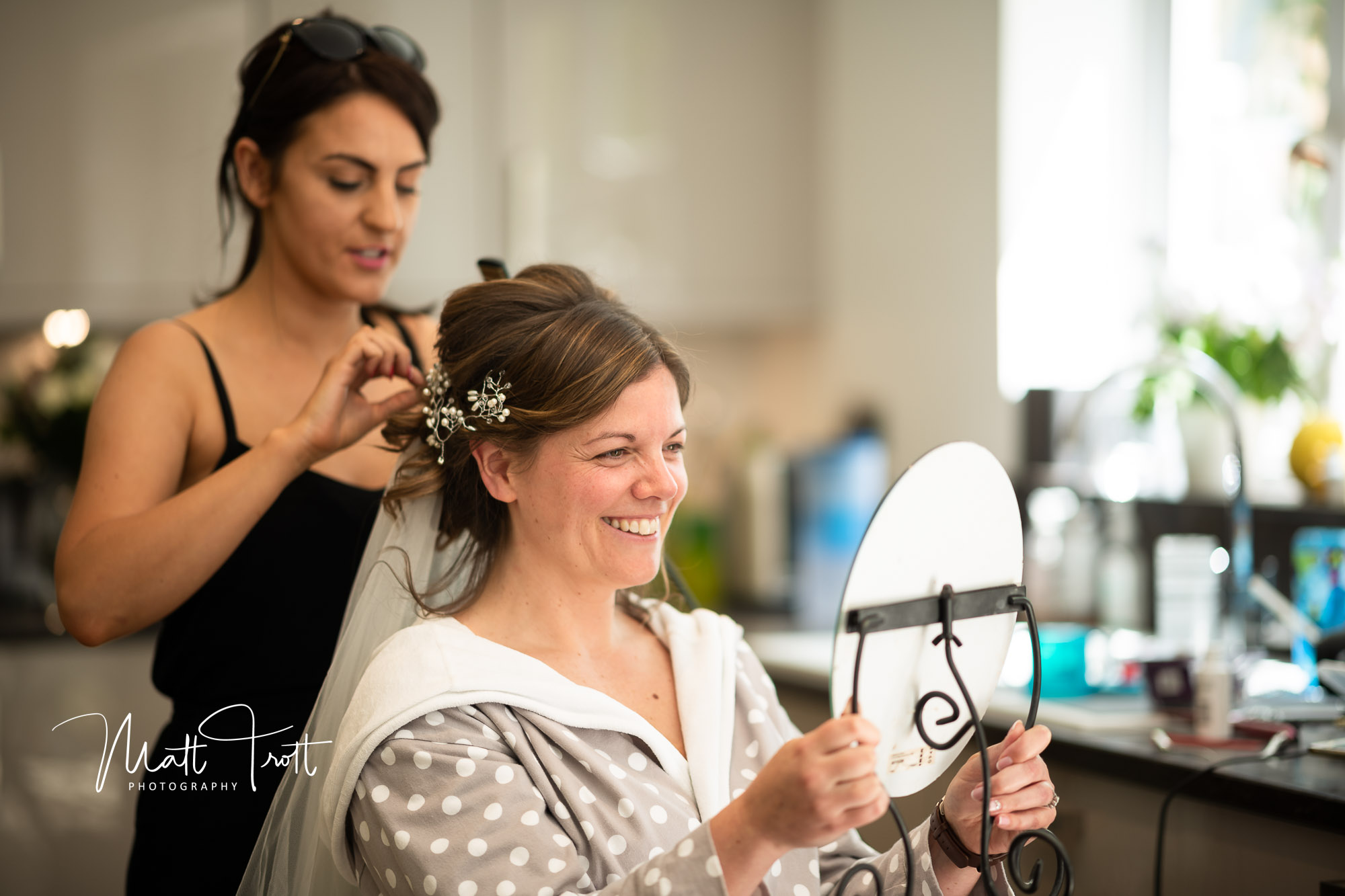 bride having her hair done for her wedding in Kent