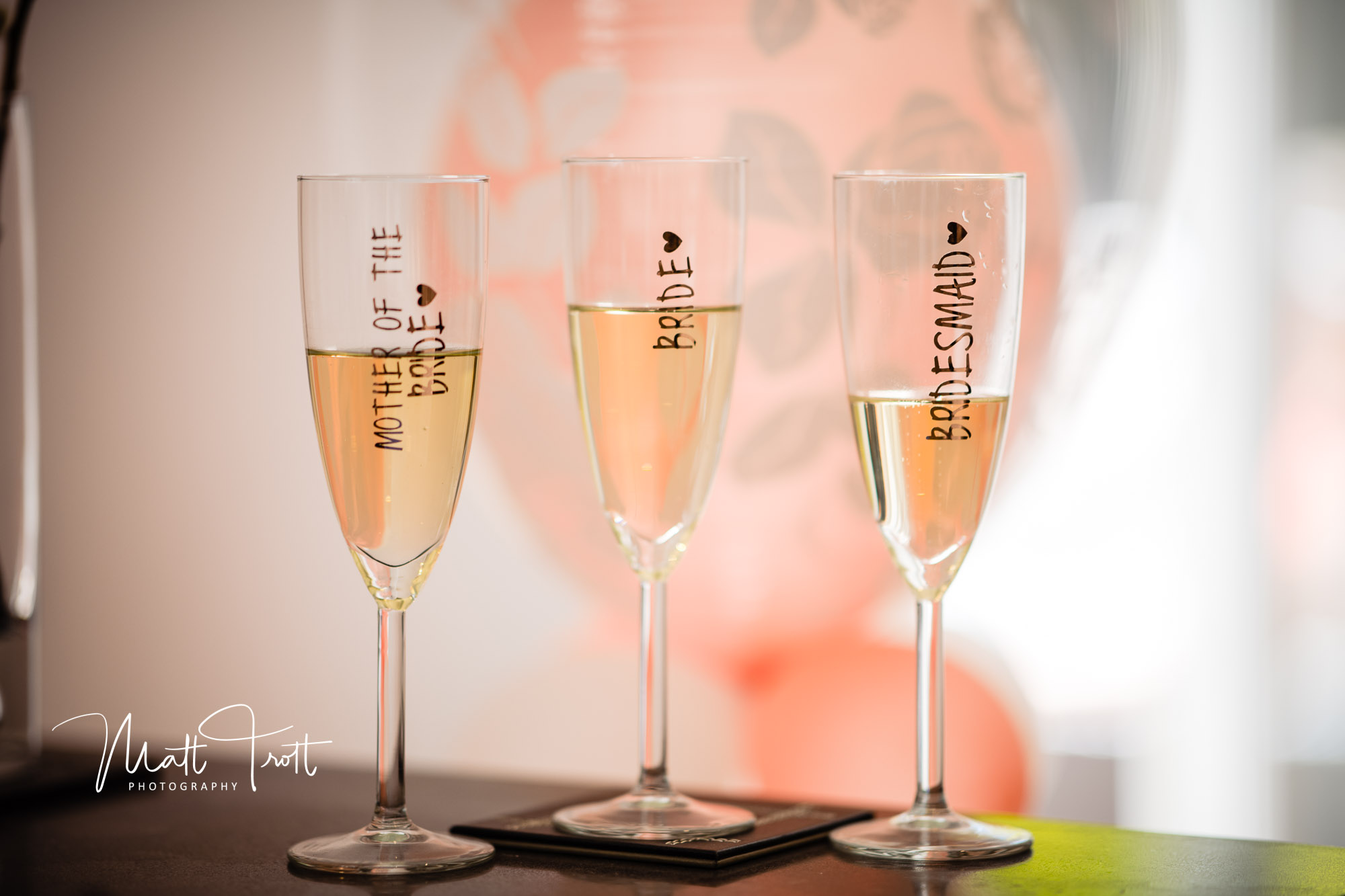 Stencilled champagne glasses with bride along the side in red 