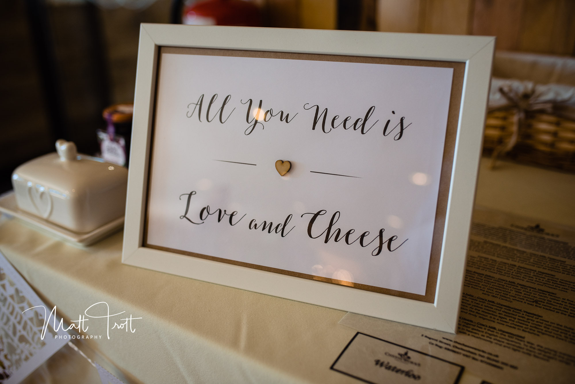 Fun wedding sign saying all you need is cheese 