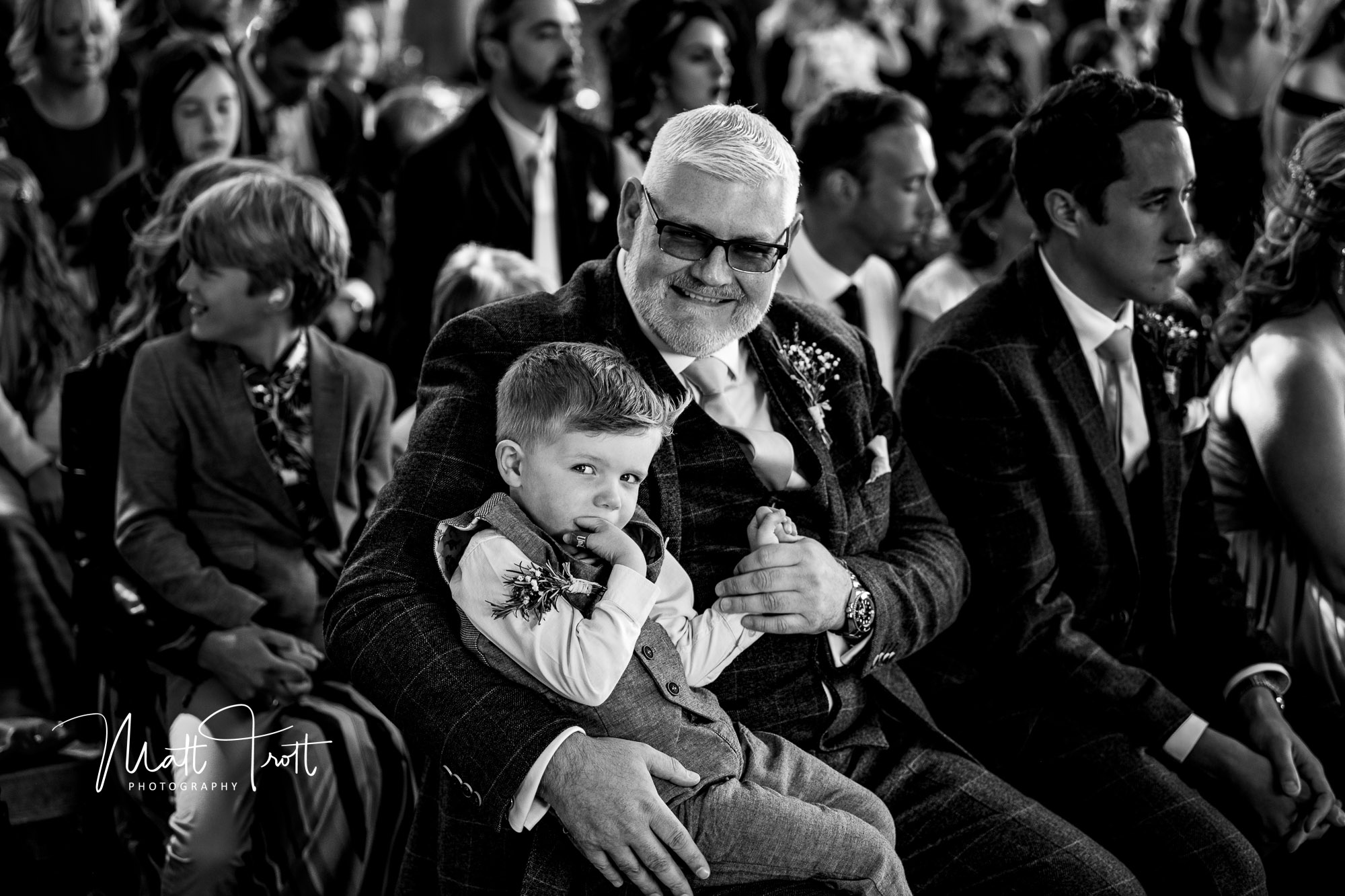 Nephew and Uncle laughing at wedding in Kent