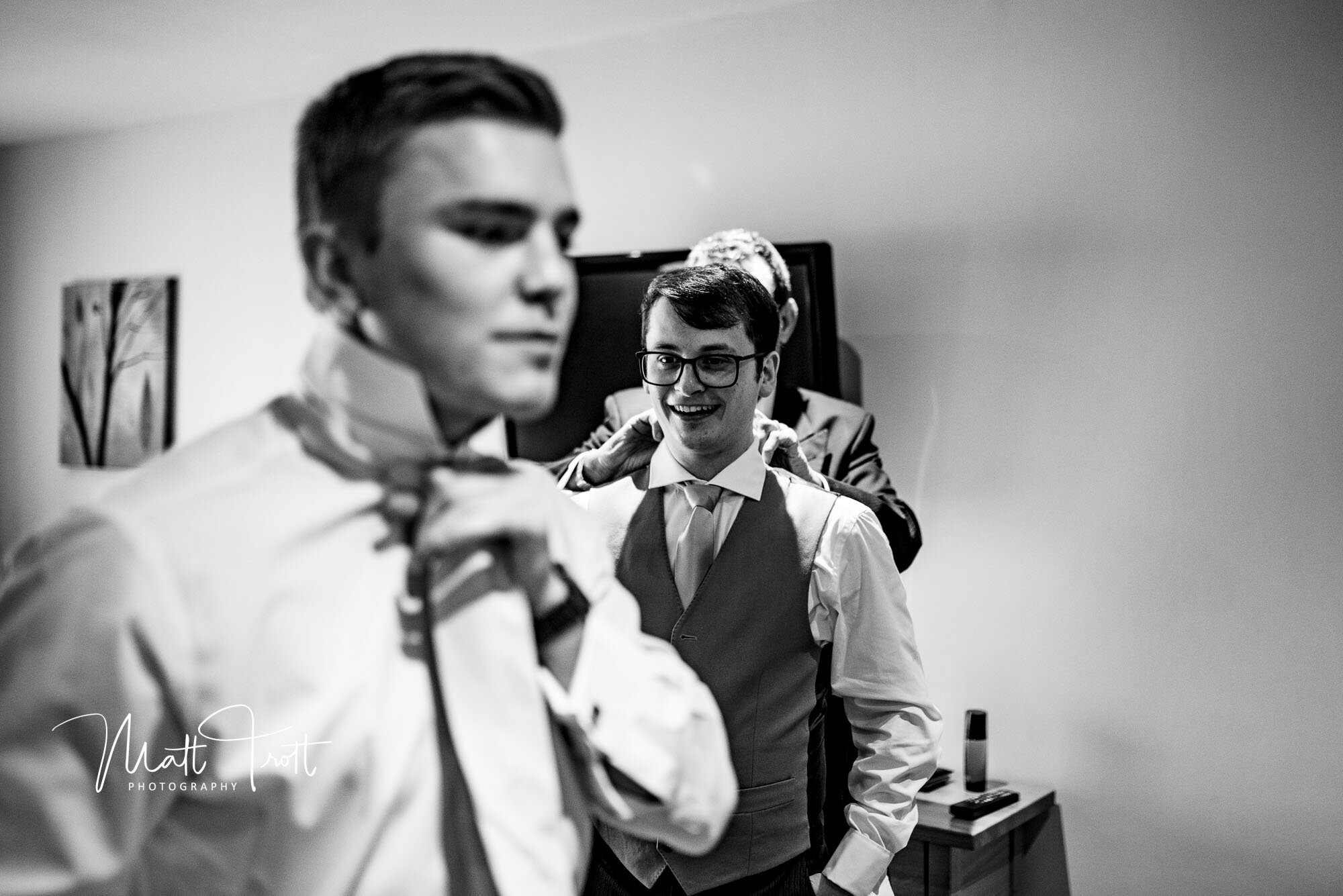Groom and best man getting ready on his wedding day