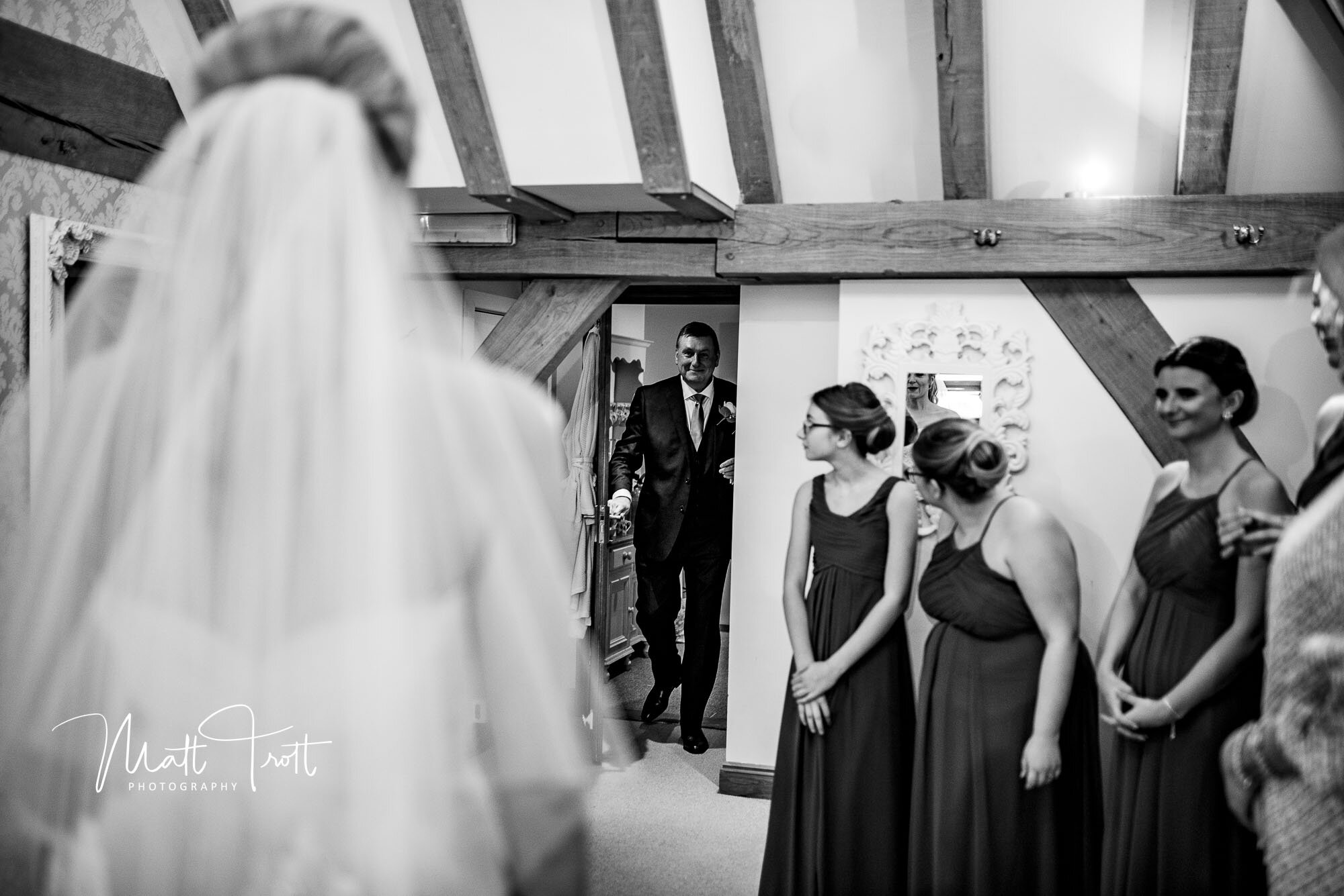 Dad seeing daughter all dressed up in her wedding dress at the Old kent Barn