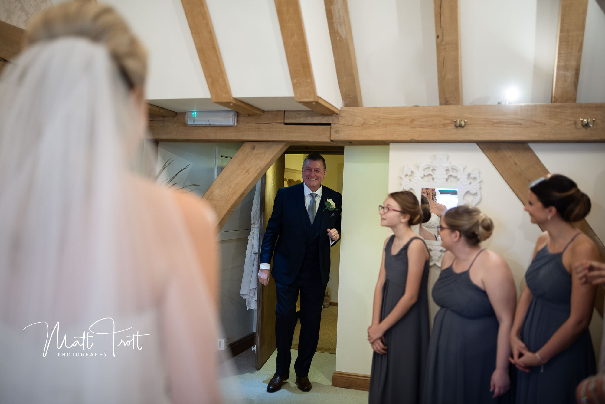Dad seeing daughter all dressed up in her wedding dress at the Old kent Barn