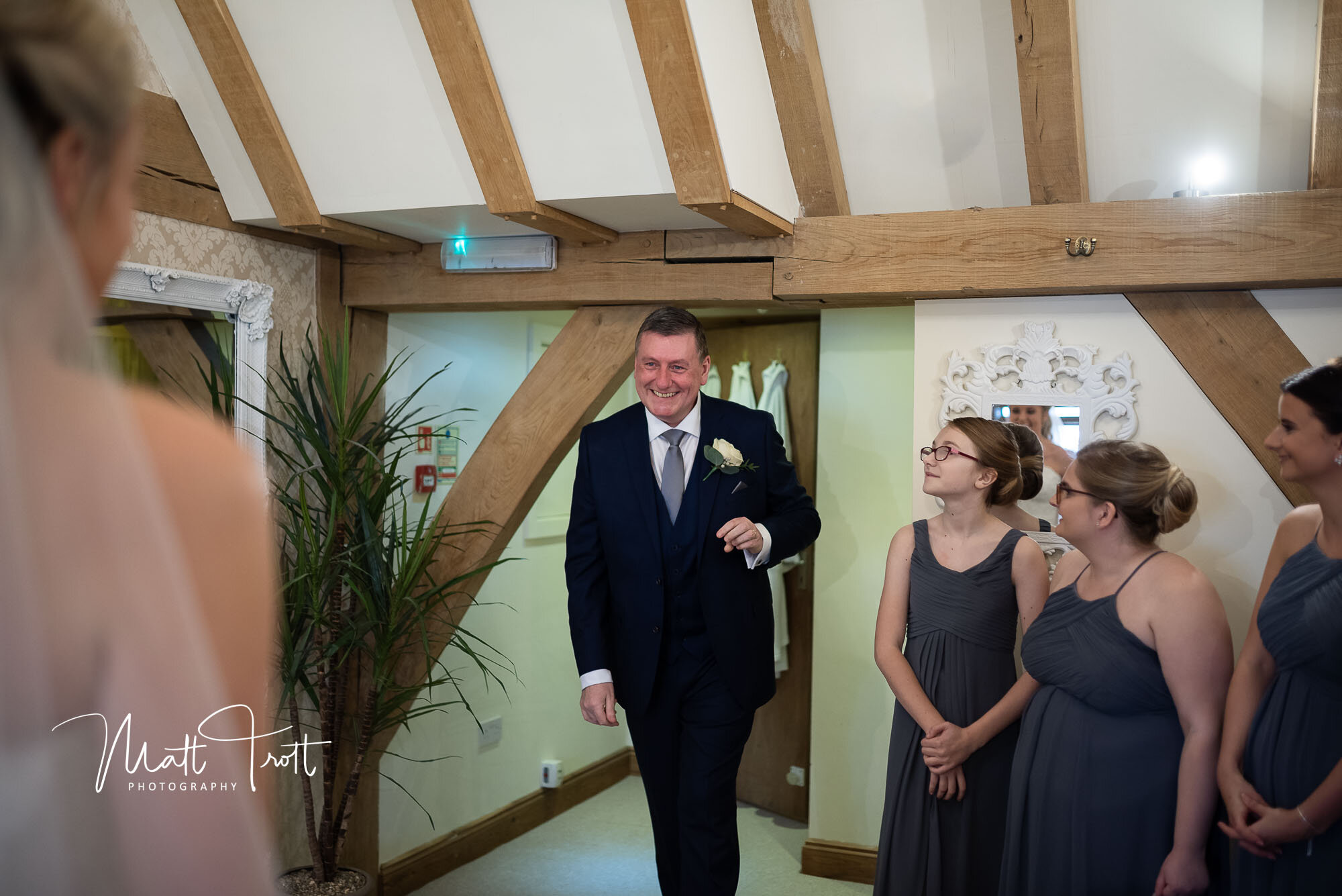Dad seeing daughter all dressed up in her wedding dress at the Old kent Barn