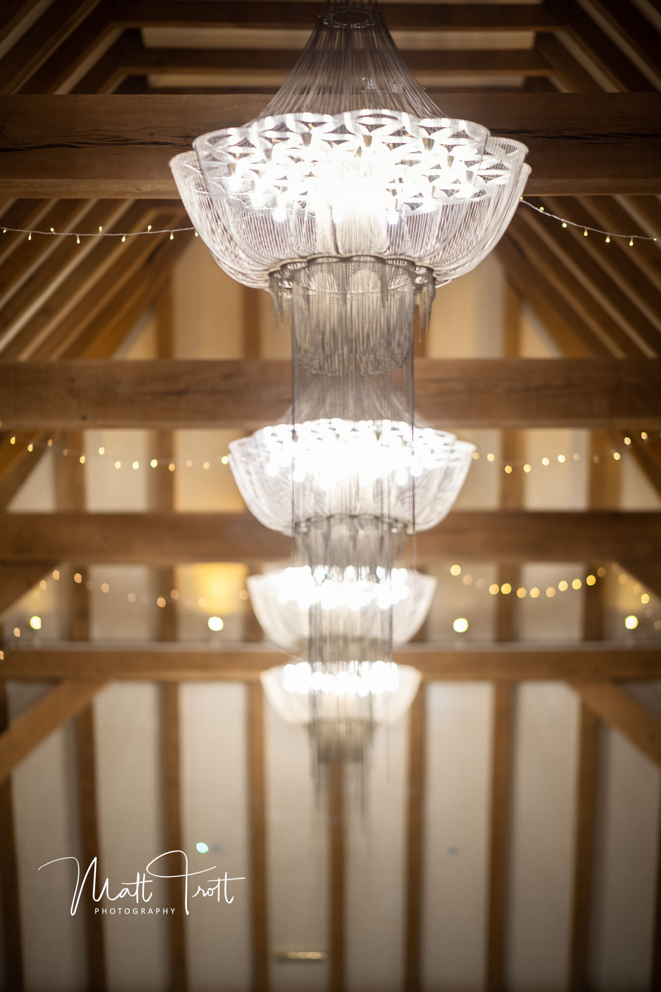 Beautiful chandeliers hanging at the old kent barn