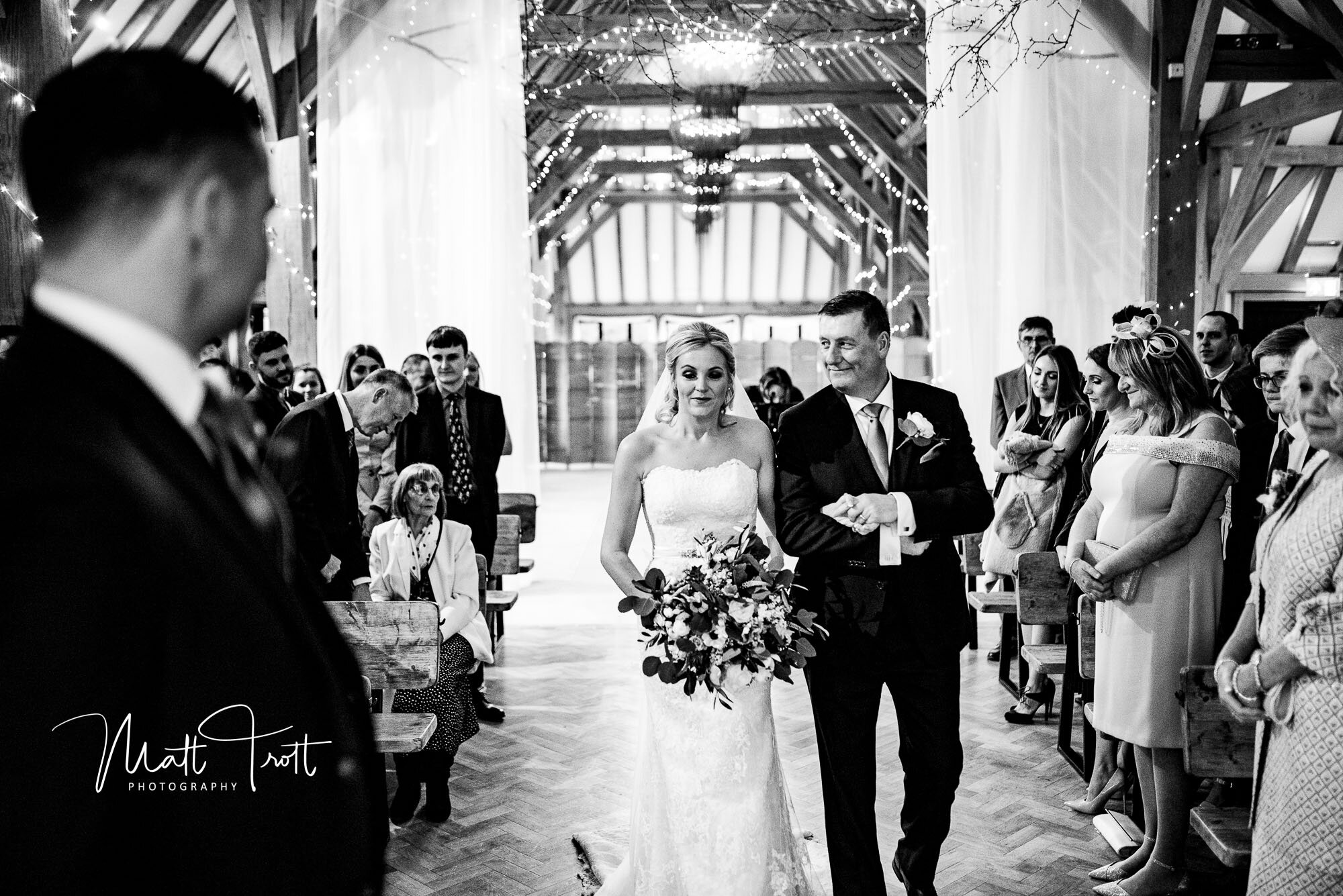 Groom sees bride for the first time at the old kent barn