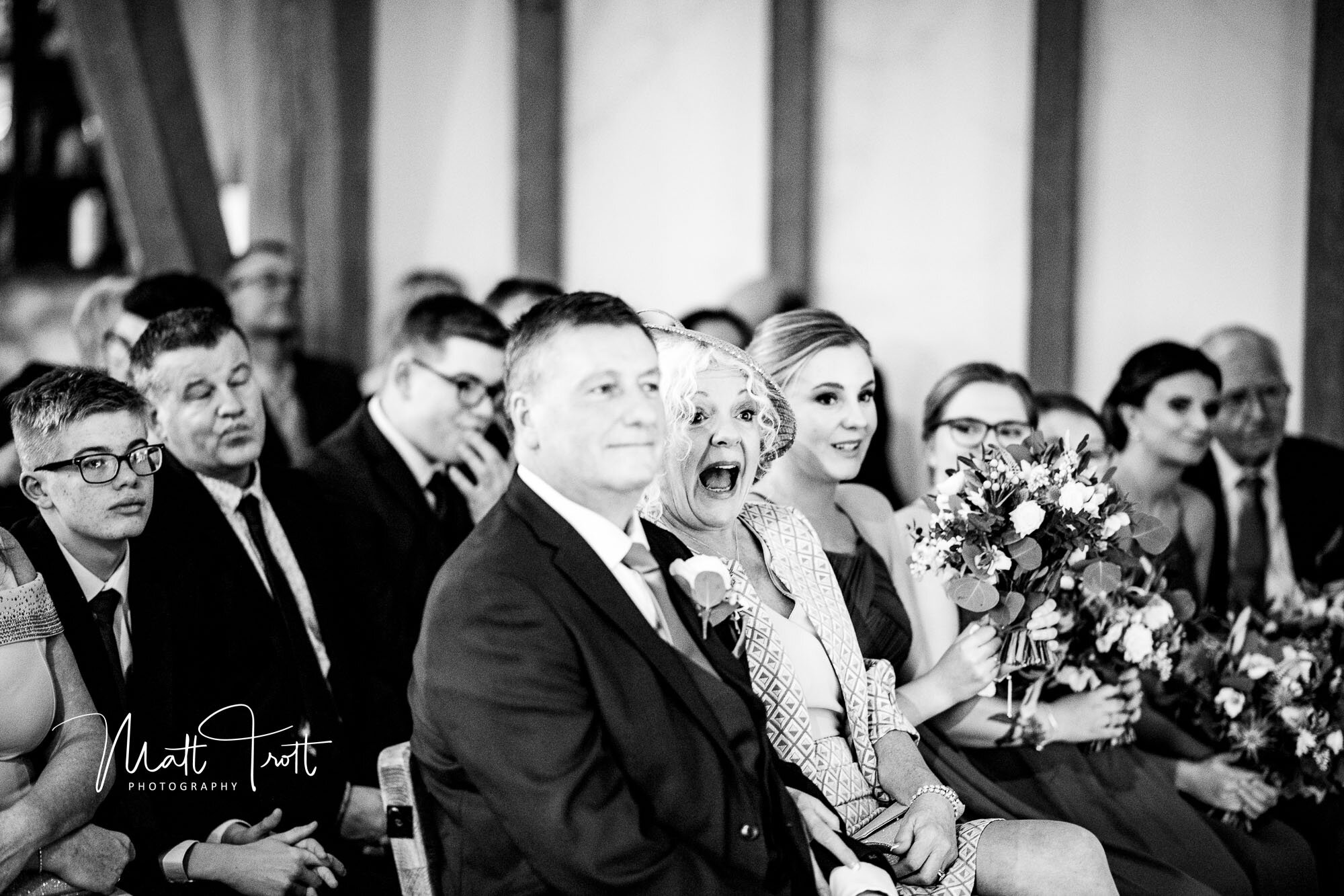 Mother of the bride laughing at ceremony