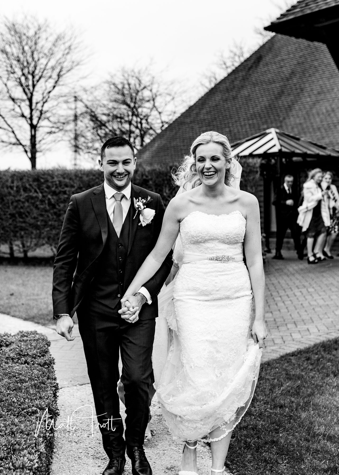 Bride and groom in the wind at the old kent barn
