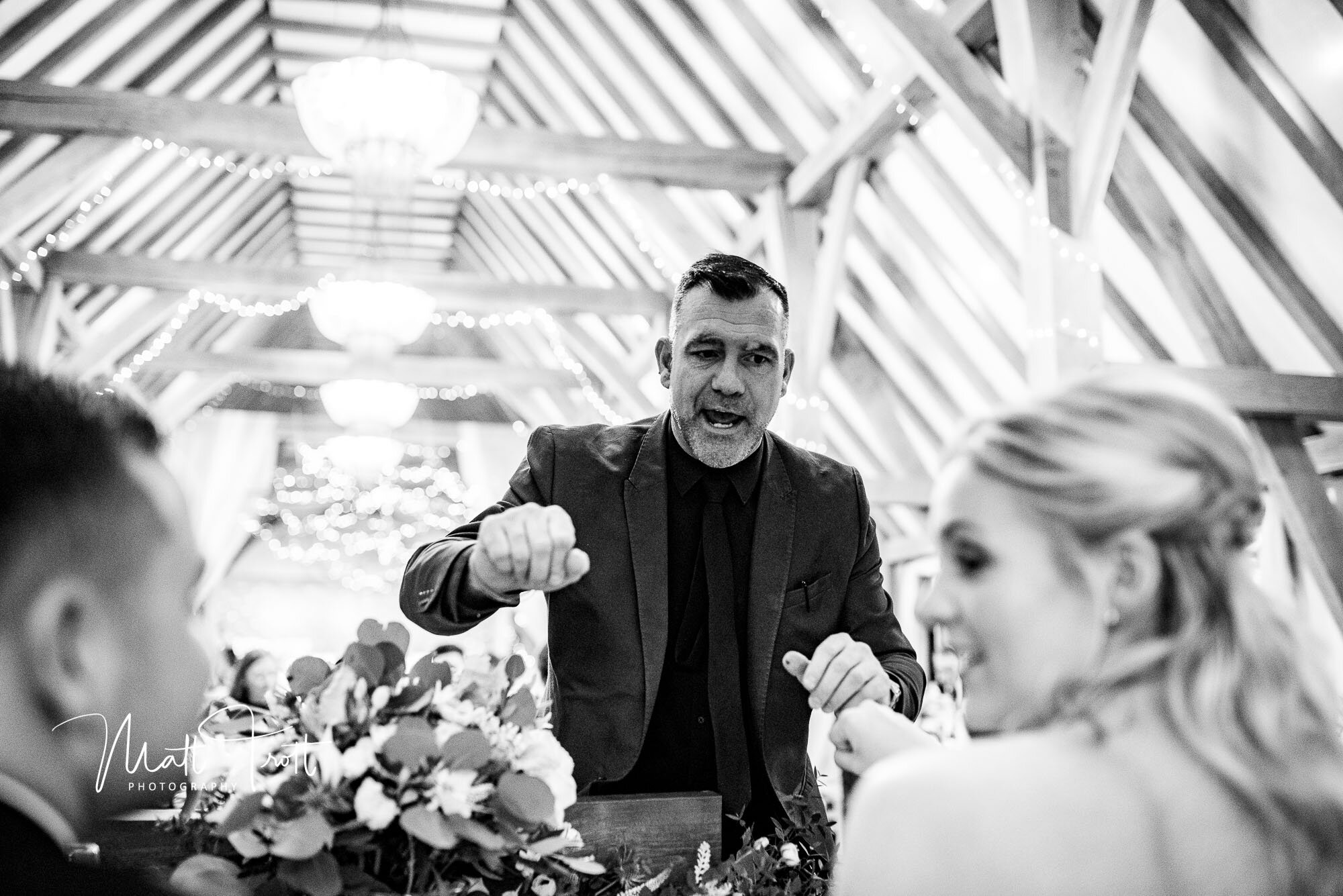 Magician showing a magic trick at the old kent barn