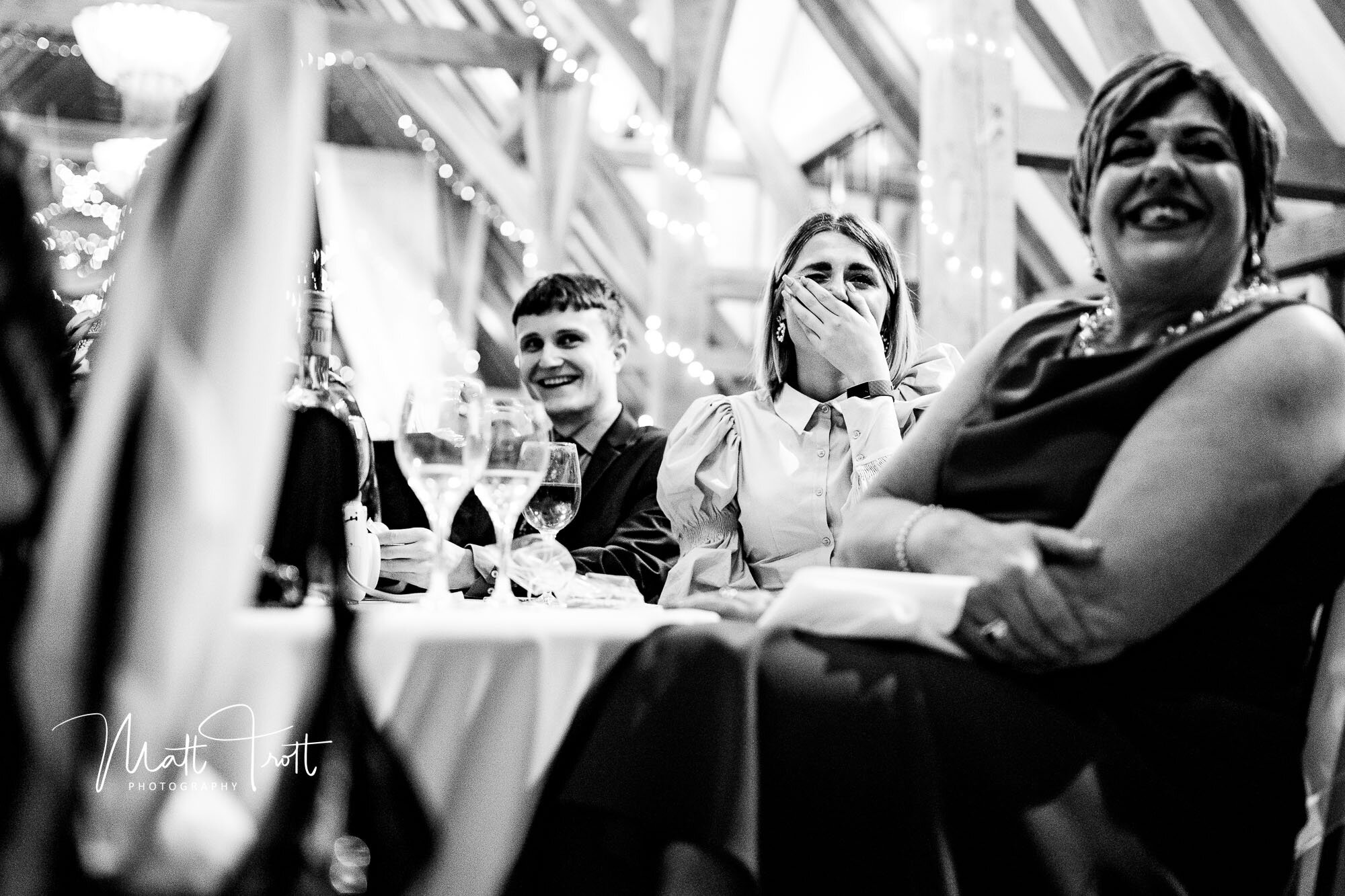 guest laughing during speeches at the old kent barn