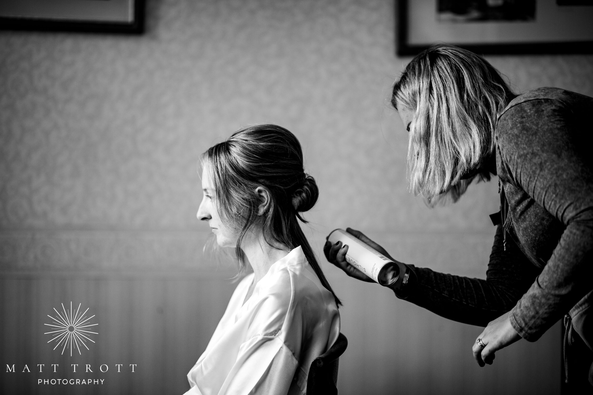 Hairspray during wedding prep at bradbourne house