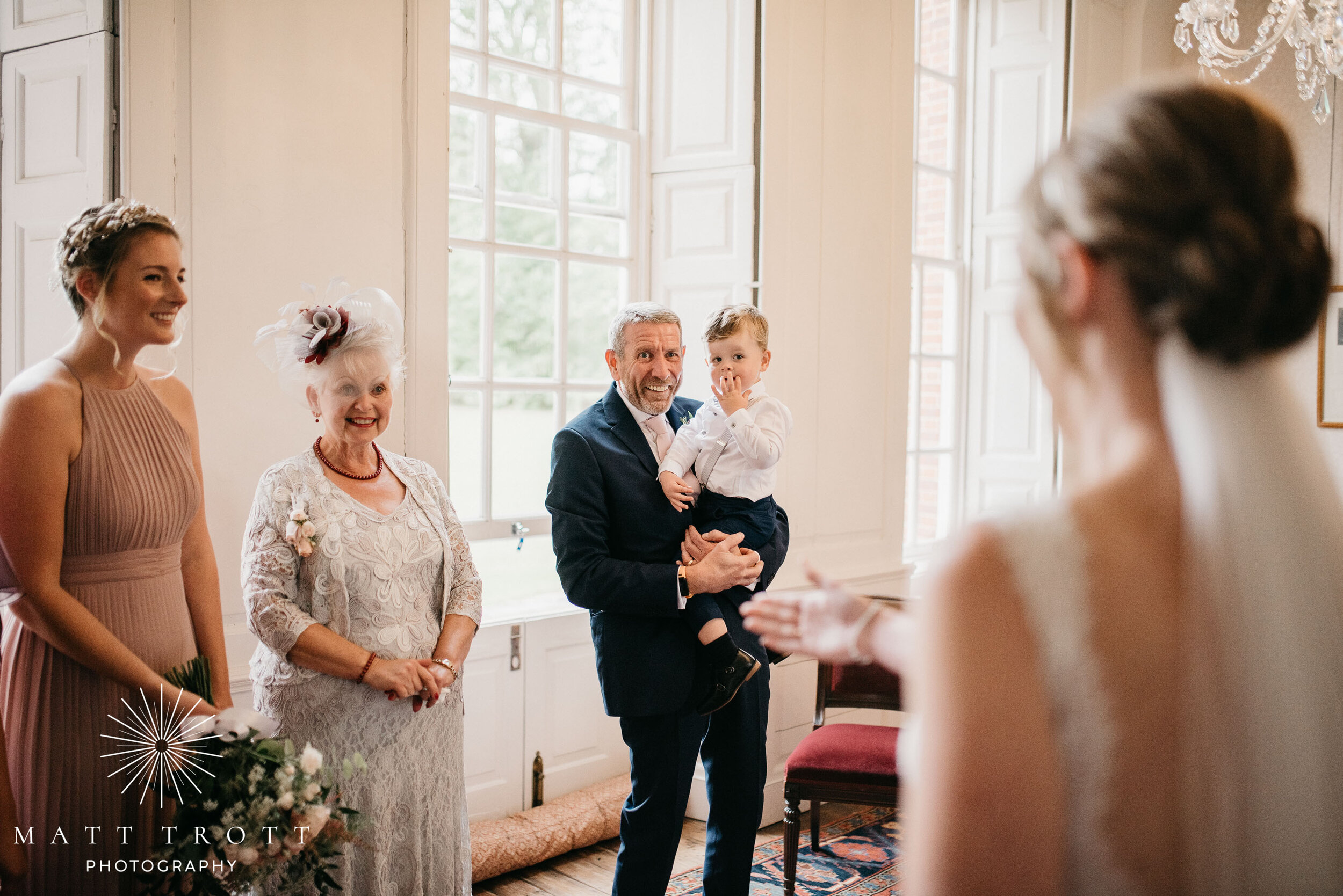 bride's son sees his mum in wedding dress for the first time