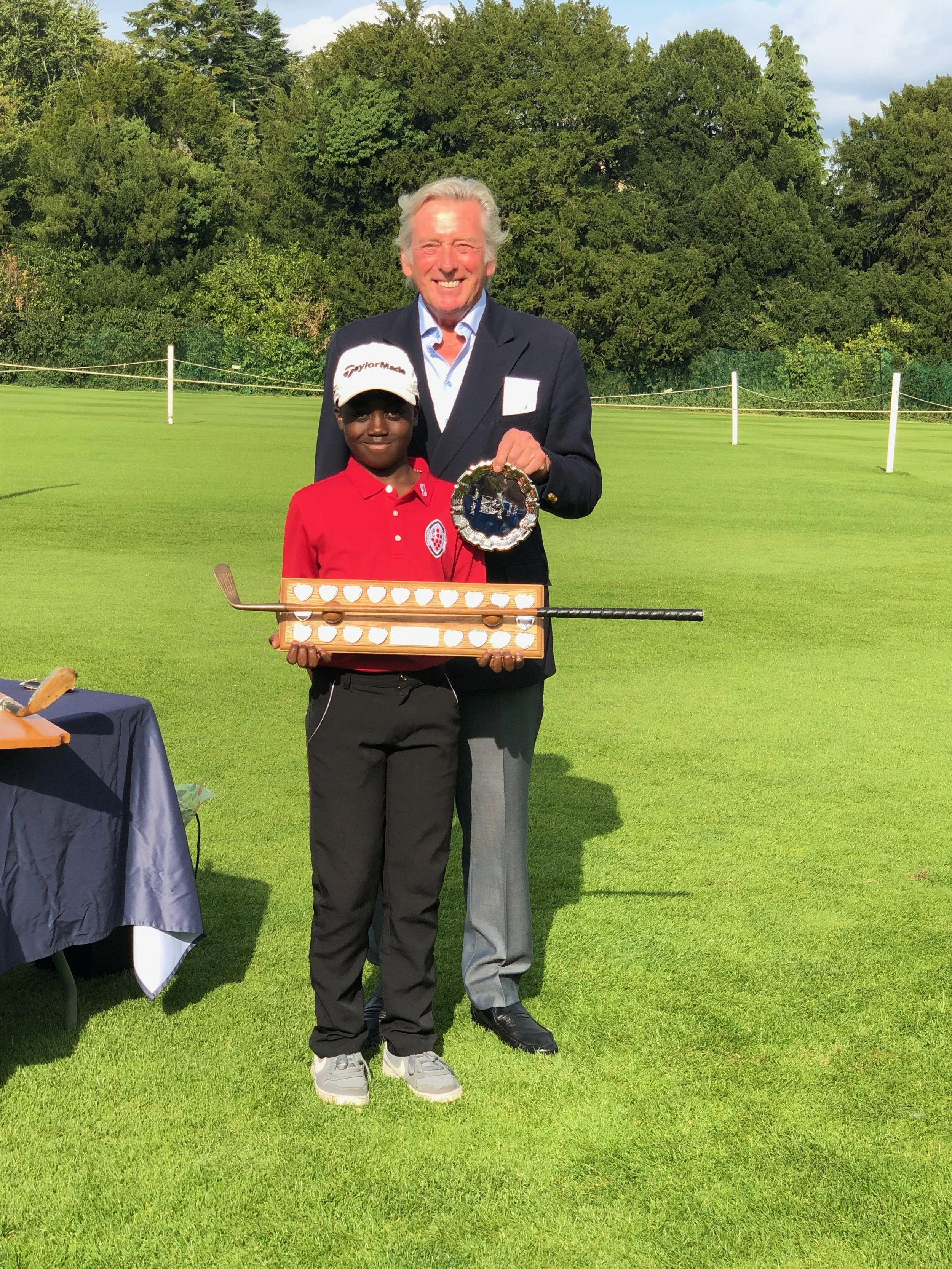 Hayden Sarfo receives trophy from Mr Michael King, Former Walker Cup and Ryder Cup player