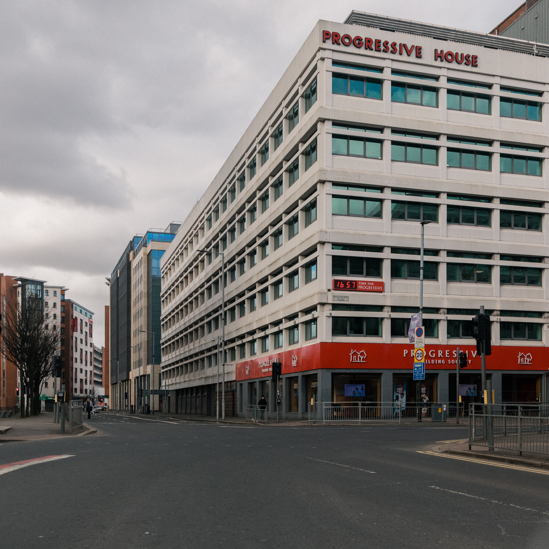 A junction, normally filled with traffic, is empty, just around the start of rush hour