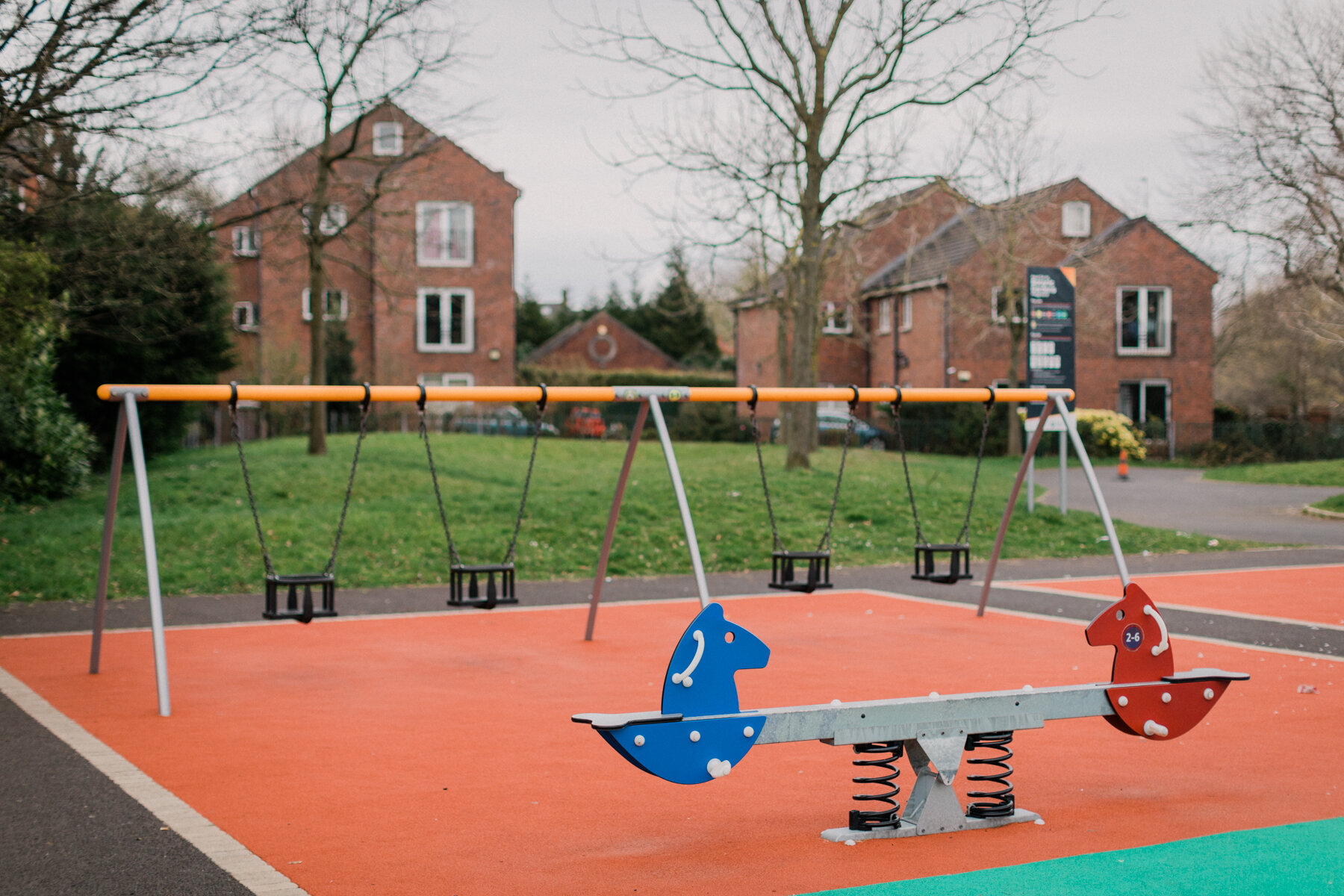 Empty swings & see-saw at the play park, Botanic Gardens, Belfast.