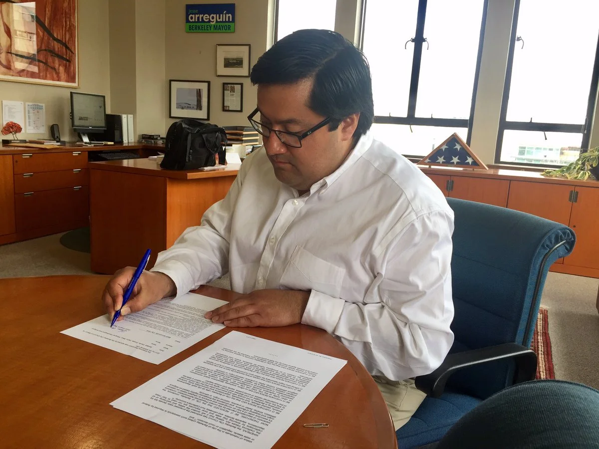 The Mayor signs into law our City's divestment from companies involved in Trump's border wall.