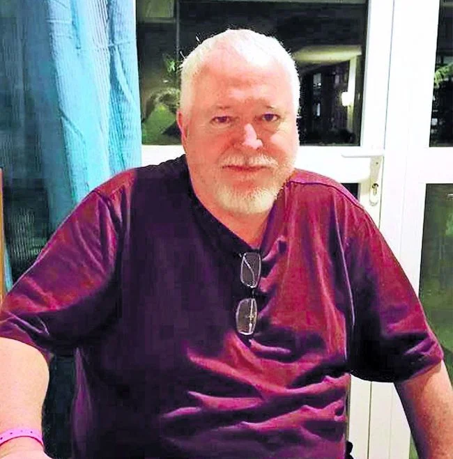 mcarthur_headshot_wearing_red_shirt.jpg