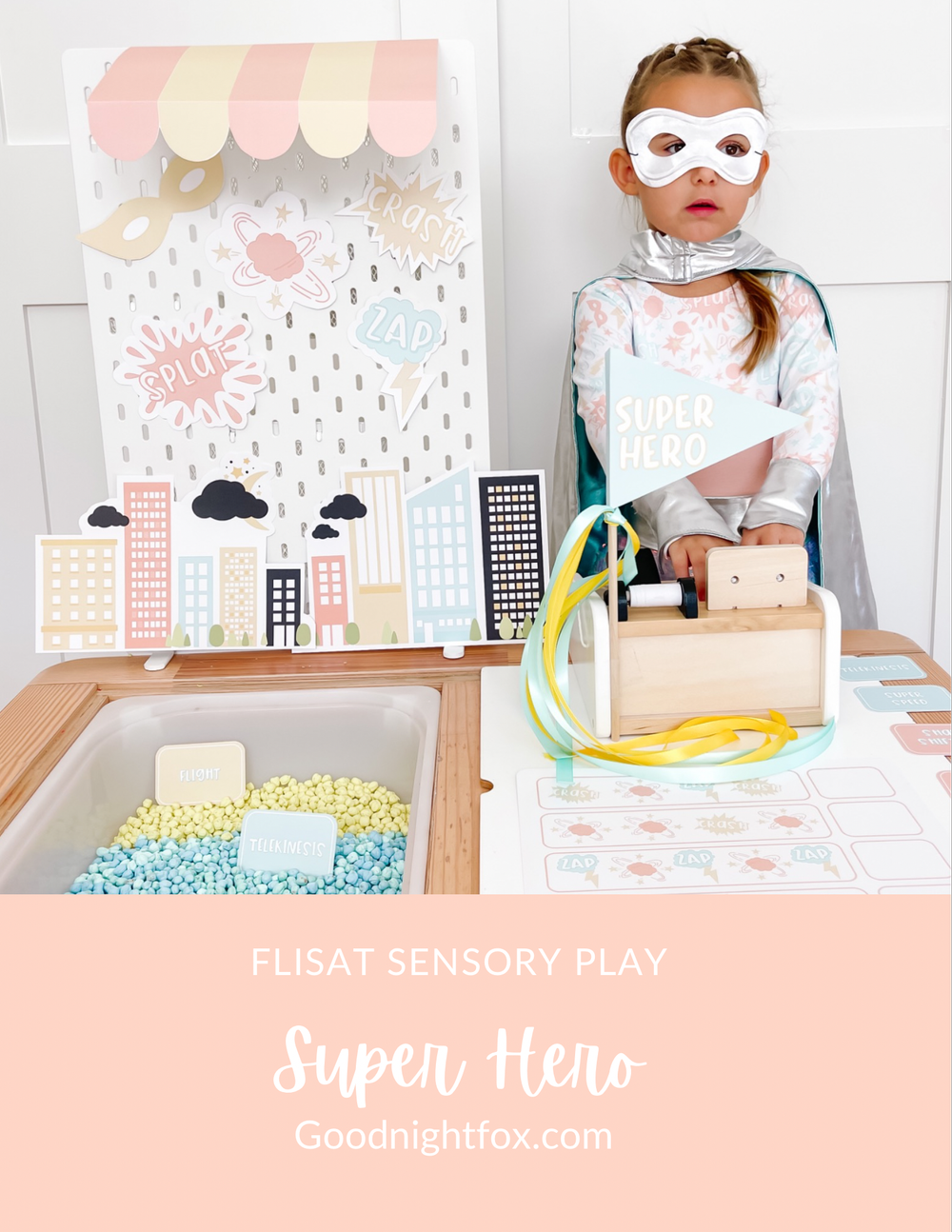 Superhero dramatic play setup with masks, cityscape and printable cards
