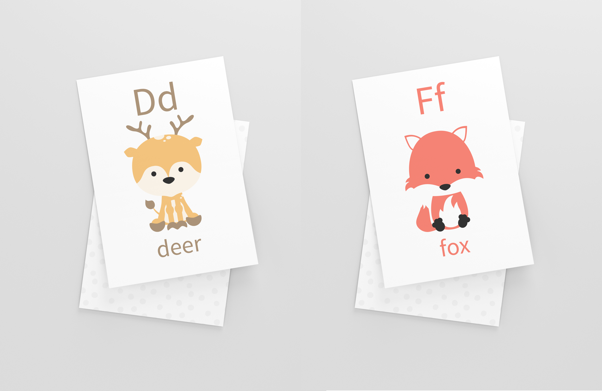 Animal alphabet flashcards showing deer and fox cards laid out flat